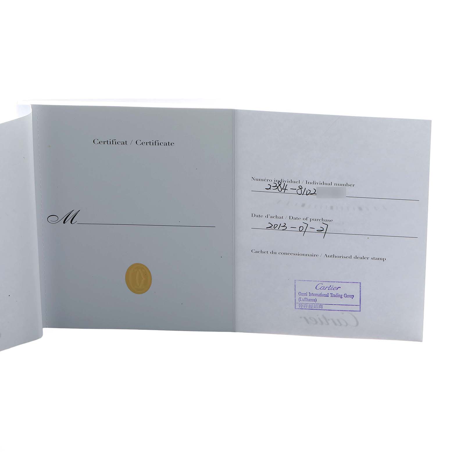 The image shows an open warranty booklet for a Cartier Tank Française watch.