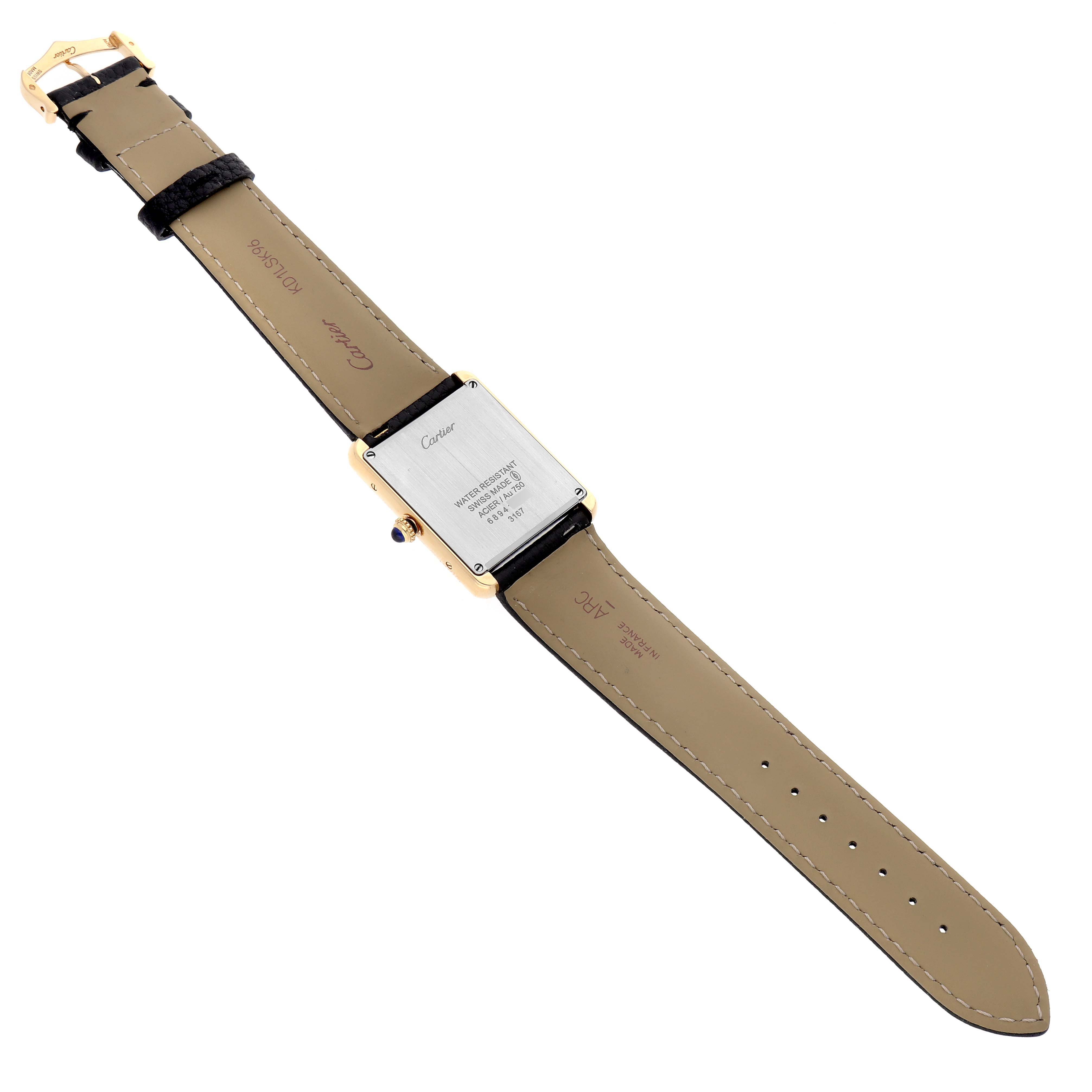 The Cartier Tank Solo W5200004 Men's Steel and Gold (two tone) Silver Dial watch is shown from the back, highlighting the case back, strap, and buckle.