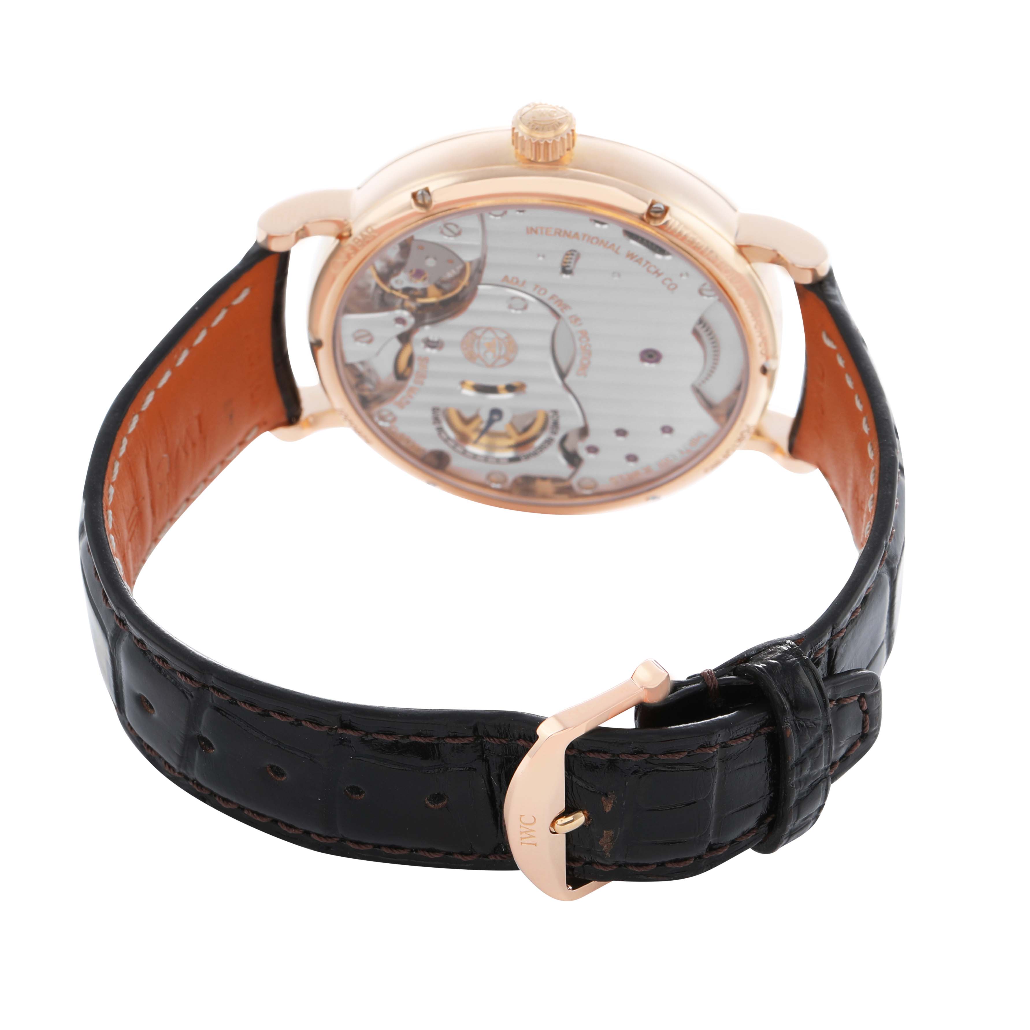 The IWC Portofino IW511101 Men's Rose Gold Silver Dial watch is shown from the back, highlighting the transparent case back and movement details.