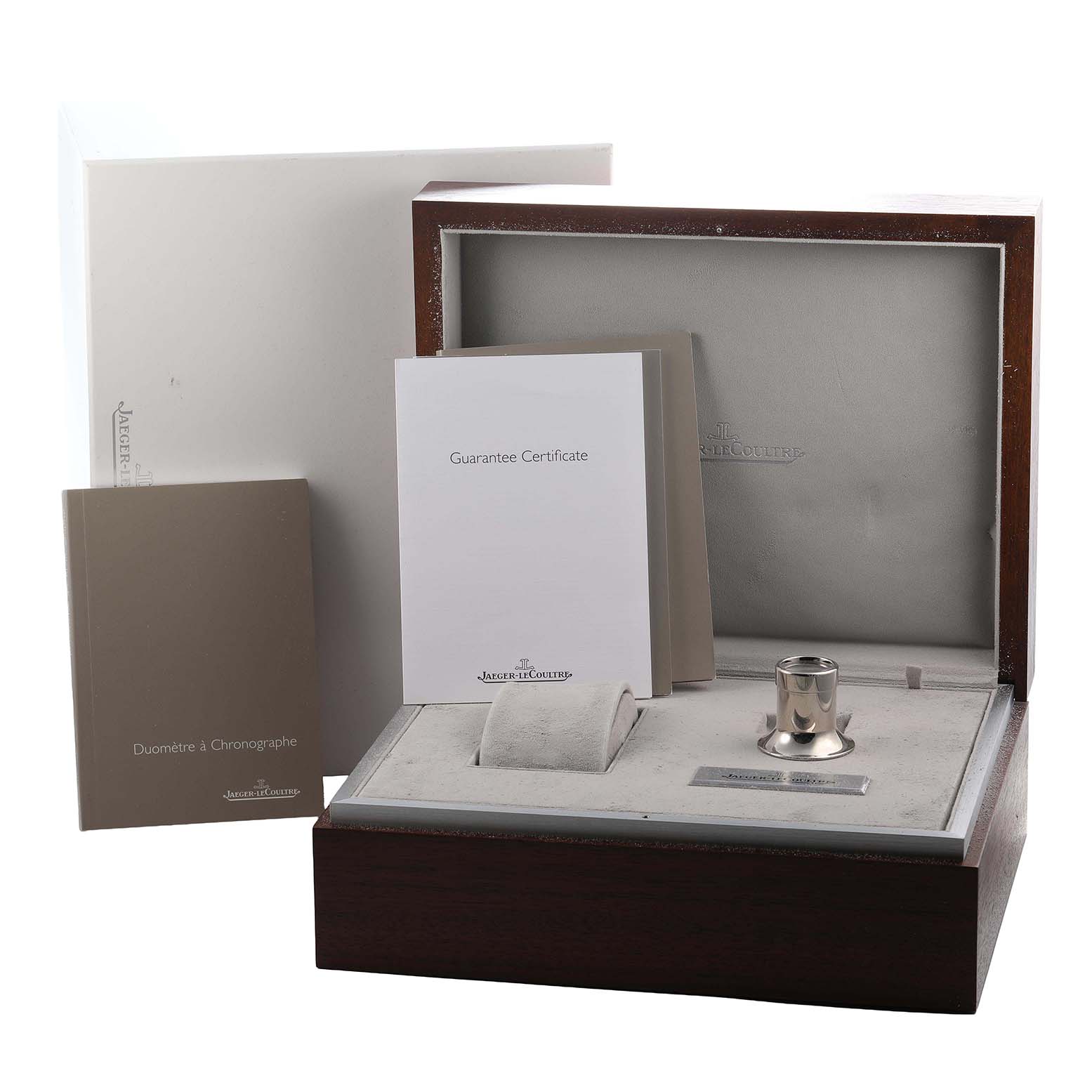 The image shows a Jaeger-LeCoultre Duometre watch box, certificate, booklet, and loupe, captured from a front angle.