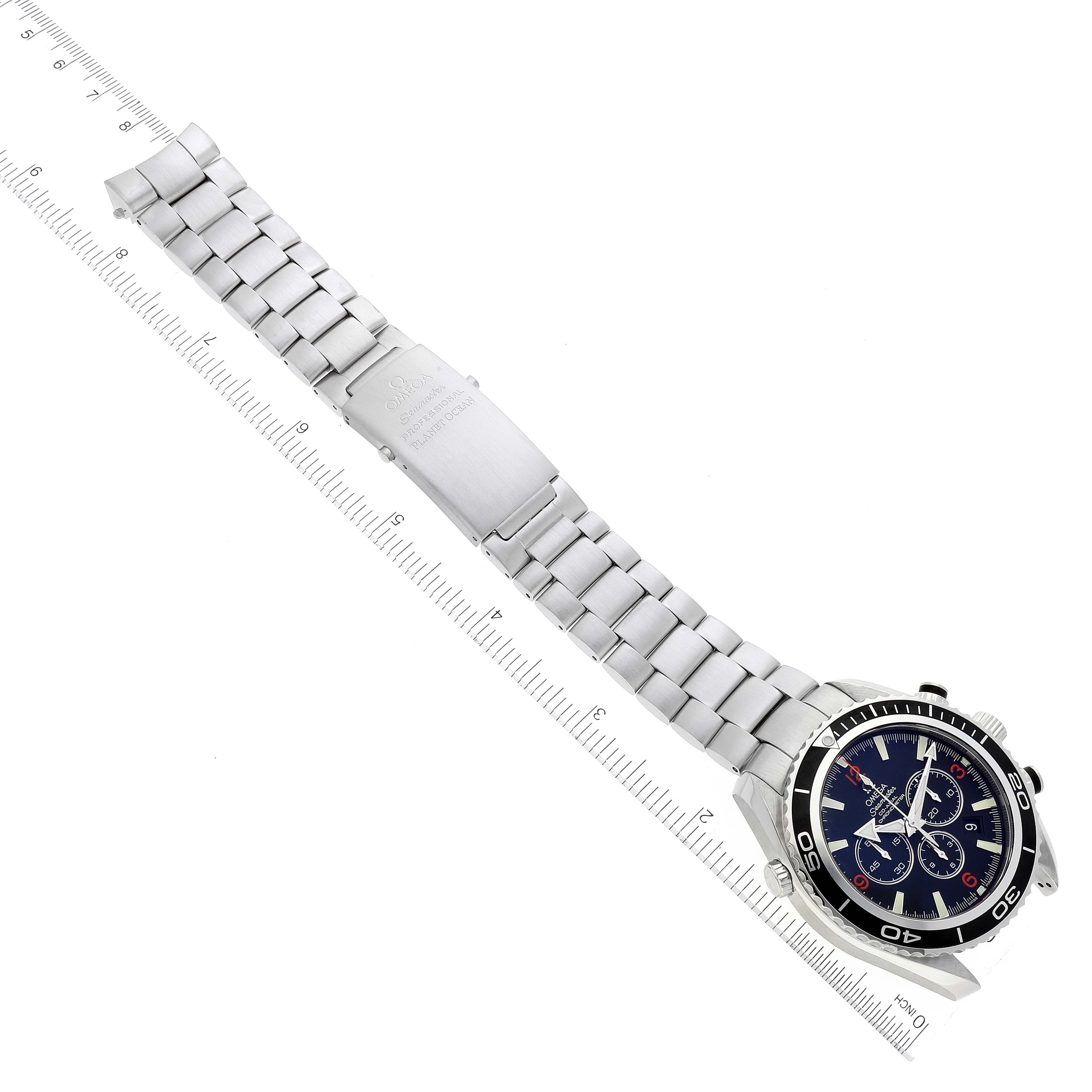 The image shows the Omega Planet Ocean 2210.50.00 Men's Stainless Steel Black Dial 2210.50.00 Men's Stainless Steel Black Dial watch in a top-down view, highlighting its face, bezel, and metal bracelet.