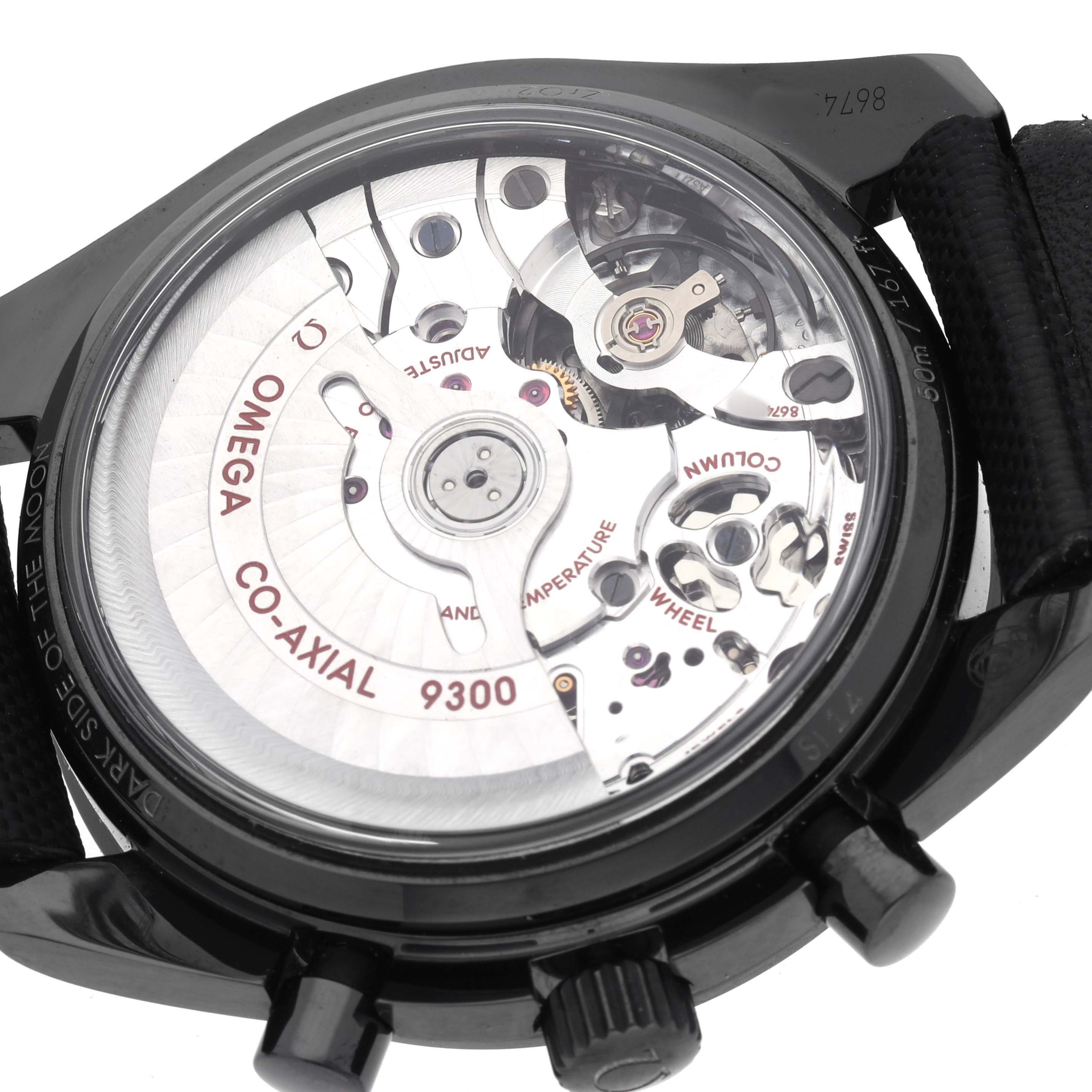 The image shows the back of an Omega Speedmaster 311.92.44.51.01.003 Men's Ceramic Black Dial watch, highlighting its Co-Axial 9300 movement.