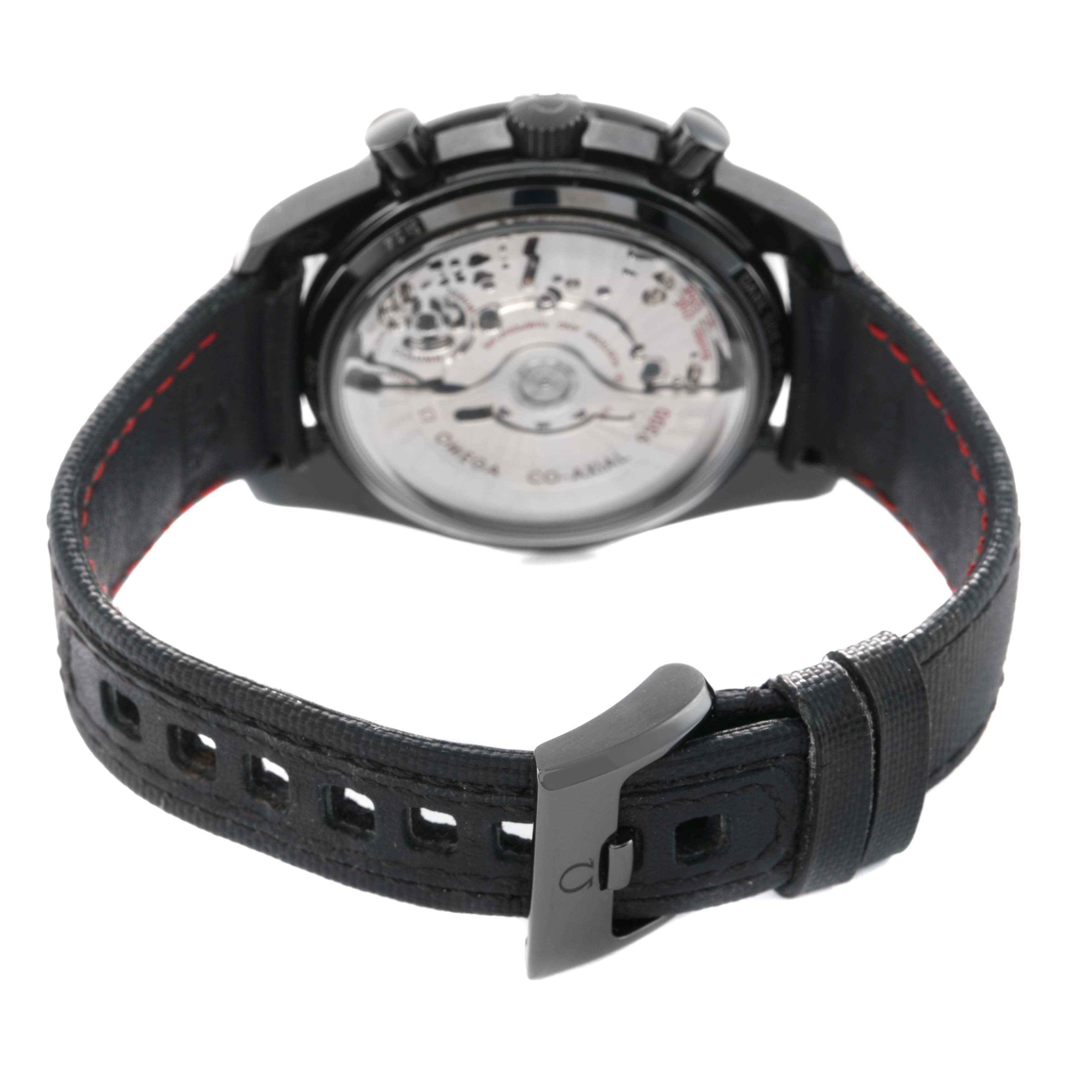 The Omega Speedmaster 311.92.44.51.01.003 Men's Ceramic Black Dial watch is shown from the back, showcasing the transparent case back and strap with a deployment clasp.