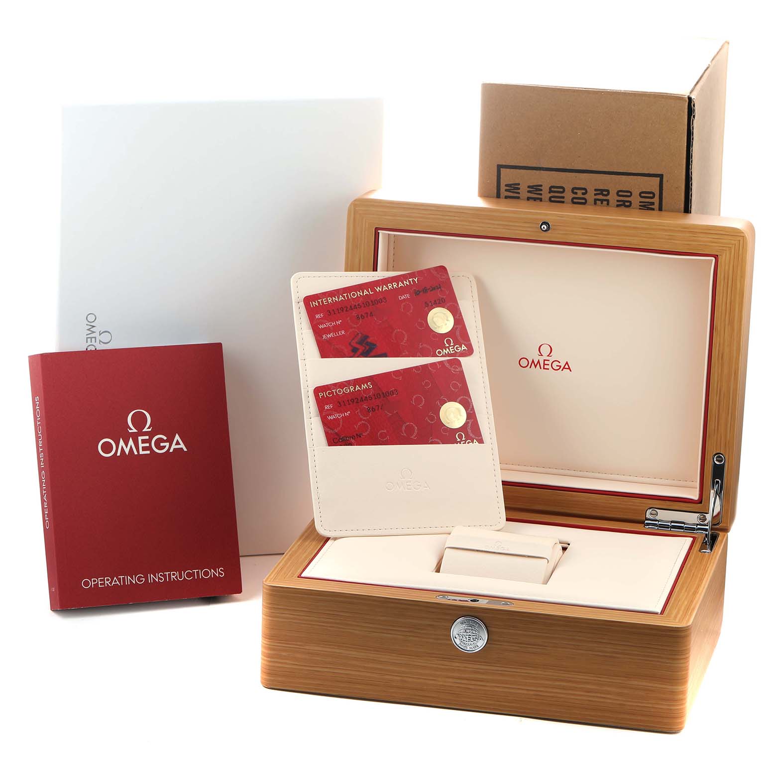 The image shows the box, warranty cards, and manual for the Omega Speedmaster 311.92.44.51.01.003 Men's Ceramic Black Dial watch.