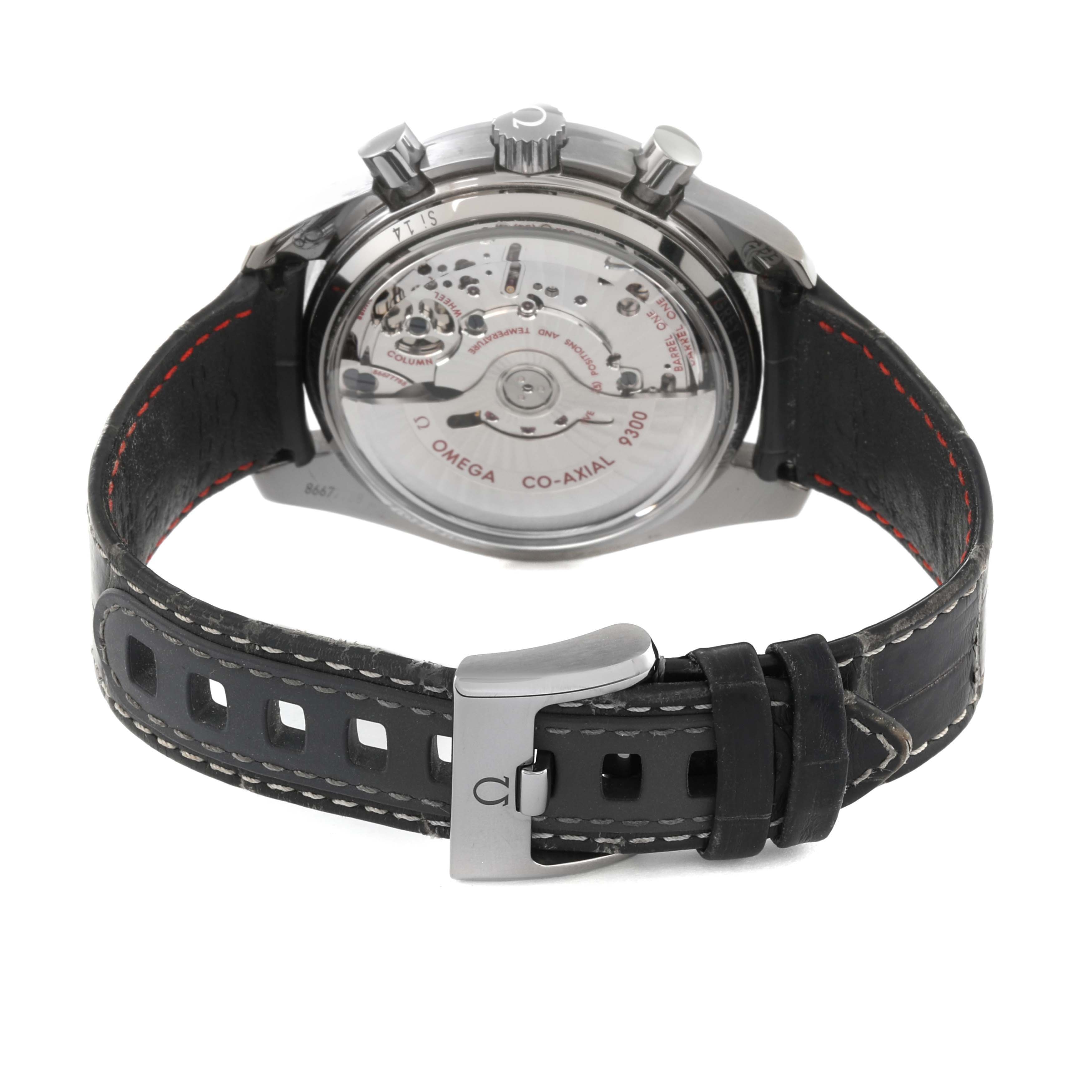 The Omega Speedmaster 311.93.44.51.99.001 Men's Ceramic Grey Dial 311.93.44.51.99.001 Men's Ceramic Grey Dial watch is shown from the back, revealing the movement and leather strap with a metal clasp.