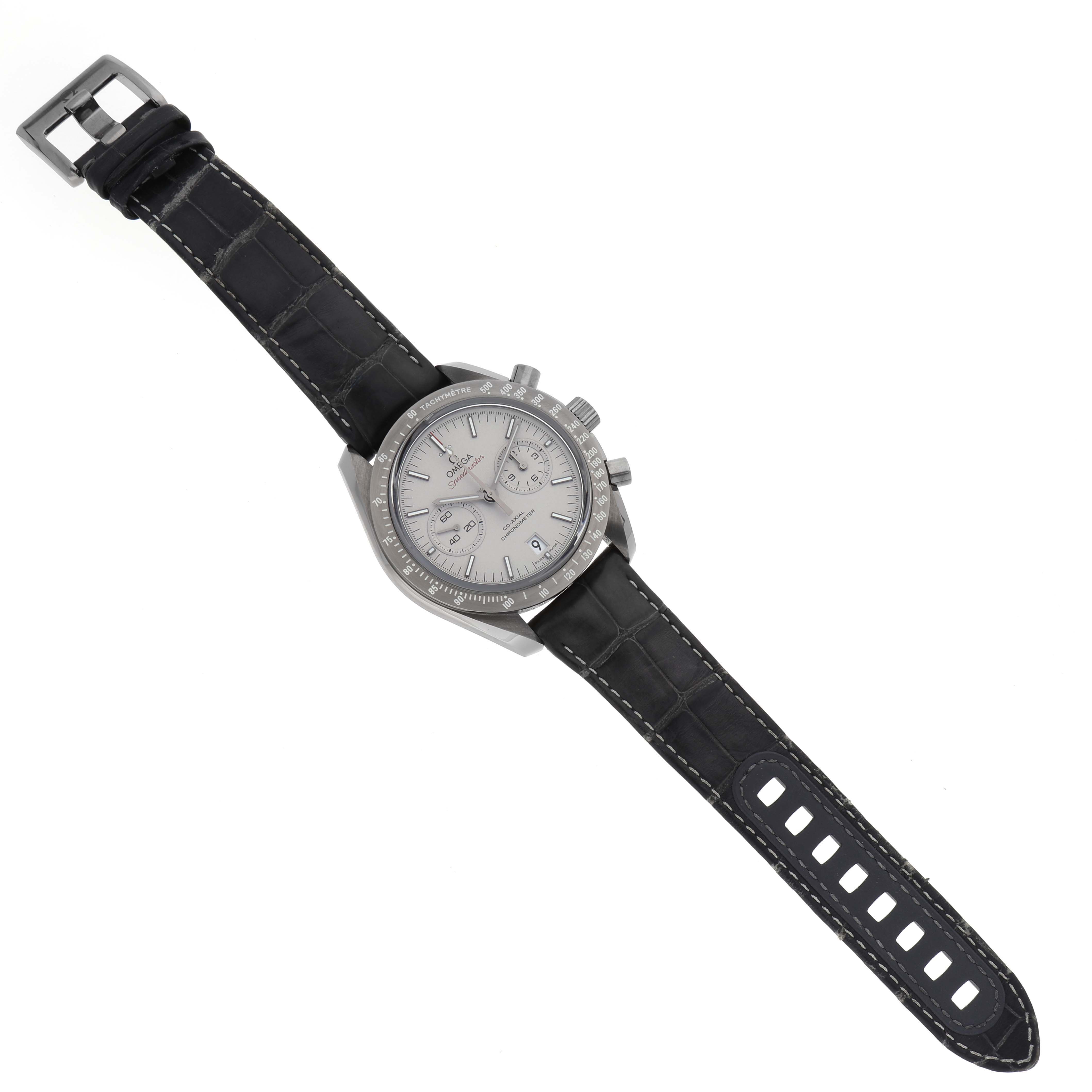 The Omega Speedmaster 311.93.44.51.99.001 Men's Ceramic Grey Dial 311.93.44.51.99.001 Men's Ceramic Grey Dial watch is shown from a top-down angle, displaying the face, bezel, and leather strap.