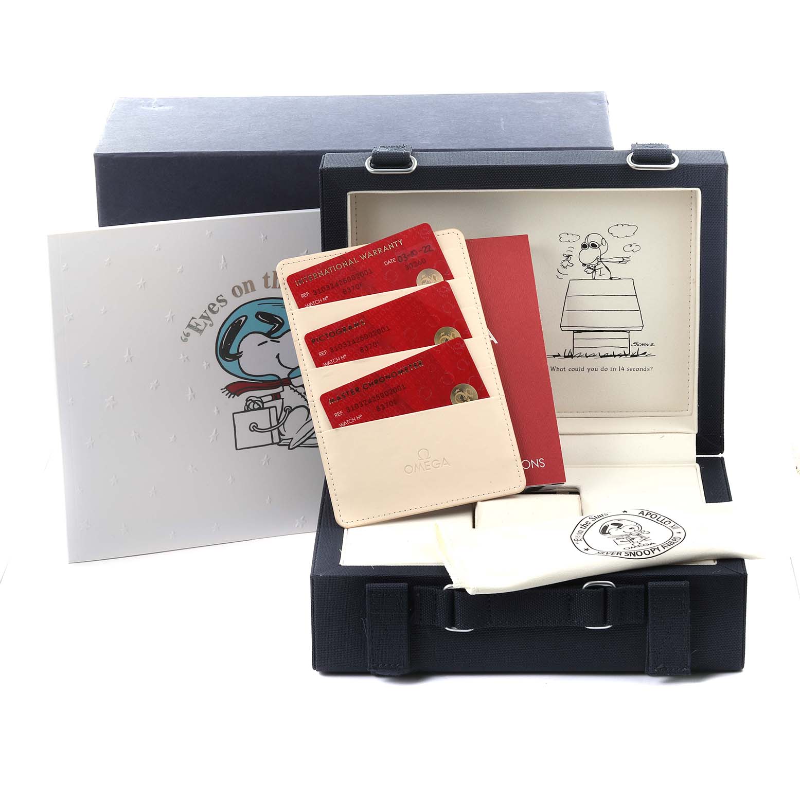 The image shows a box for the Omega Speedmaster 310.32.42.50.02.001 Men
s Stainless Steel Silver Dial 310.32.42.50.02.001 Men
s Stainless Steel Silver Dial, displaying warranty cards, documentation, and branded packaging.
