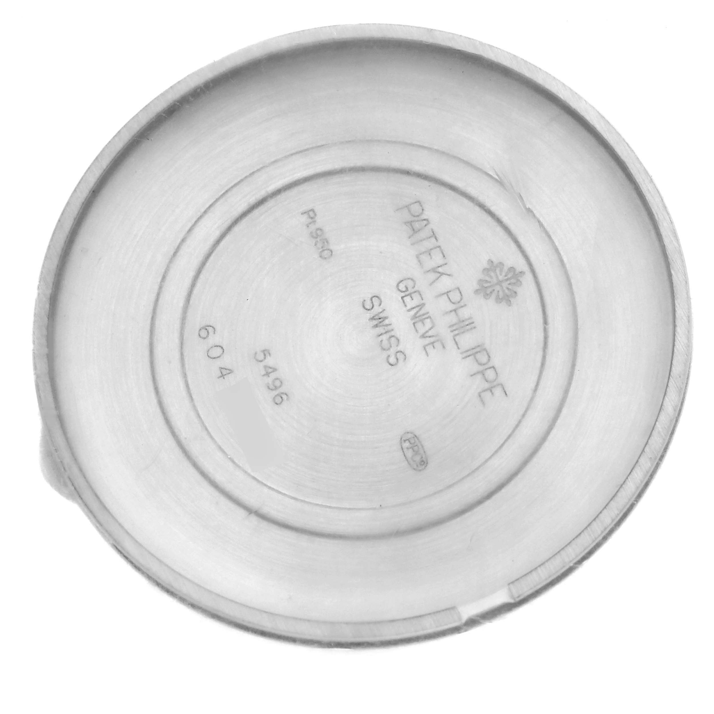 The image shows the inside case back of a Patek Philippe Complications 5496P-014 Men's Platinum Brown Dial 5496P-014 Men's Platinum Brown Dial watch, viewed from above, displaying engravings.