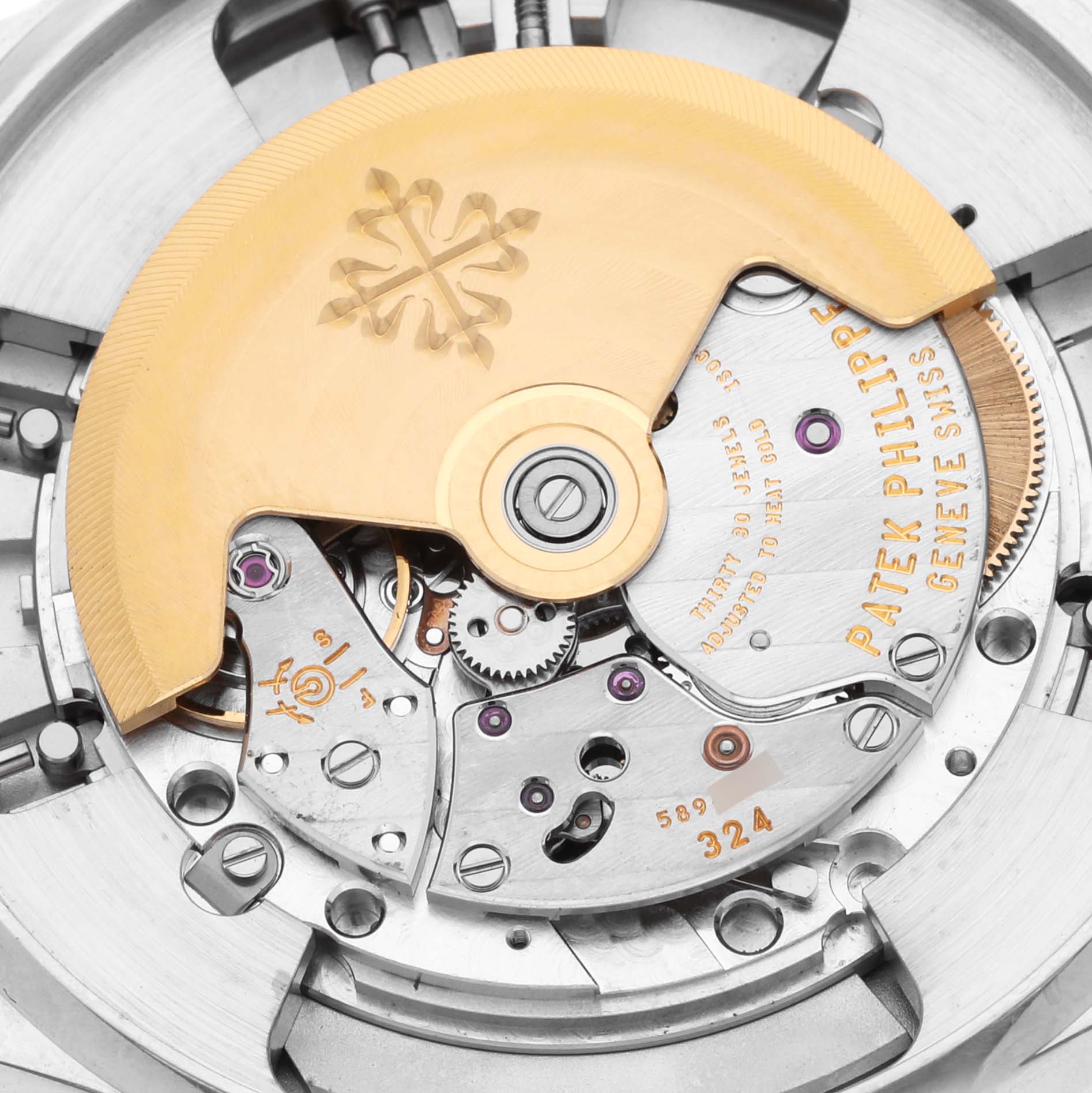 The image shows the movement mechanics of the Patek Philippe Complications 5496P-014 Men's Platinum Brown Dial 5496P-014 Men's Platinum Brown Dial model from a top-down angle, highlighting its intricate parts.