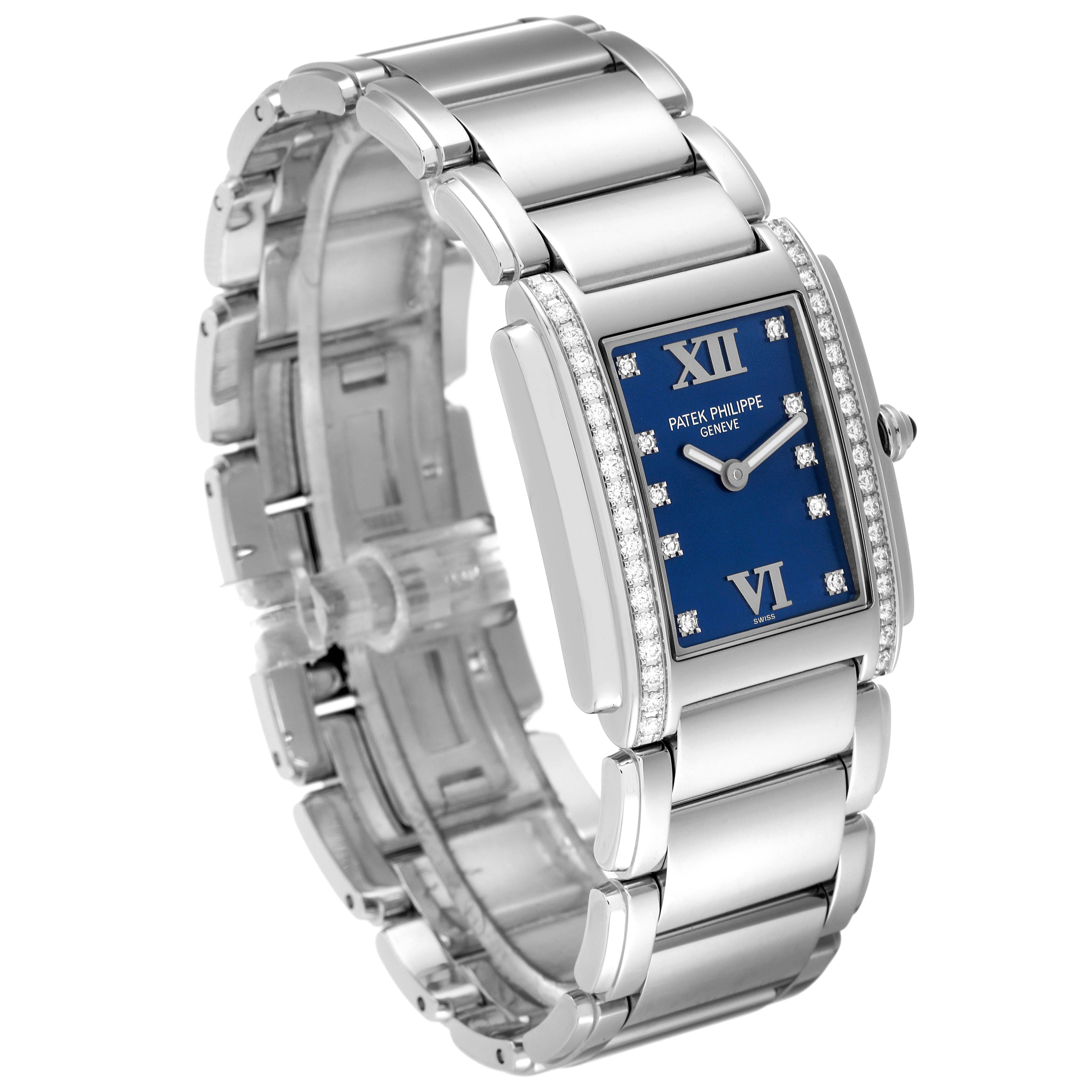 The Patek Philippe Twenty-4 4910-10A-012 Women's Stainless Steel Blue Dial 4910-10A-012 Women's Stainless Steel Blue Dial watch is shown at an angled side view, highlighting its blue dial, bracelet, and diamonds around the case.