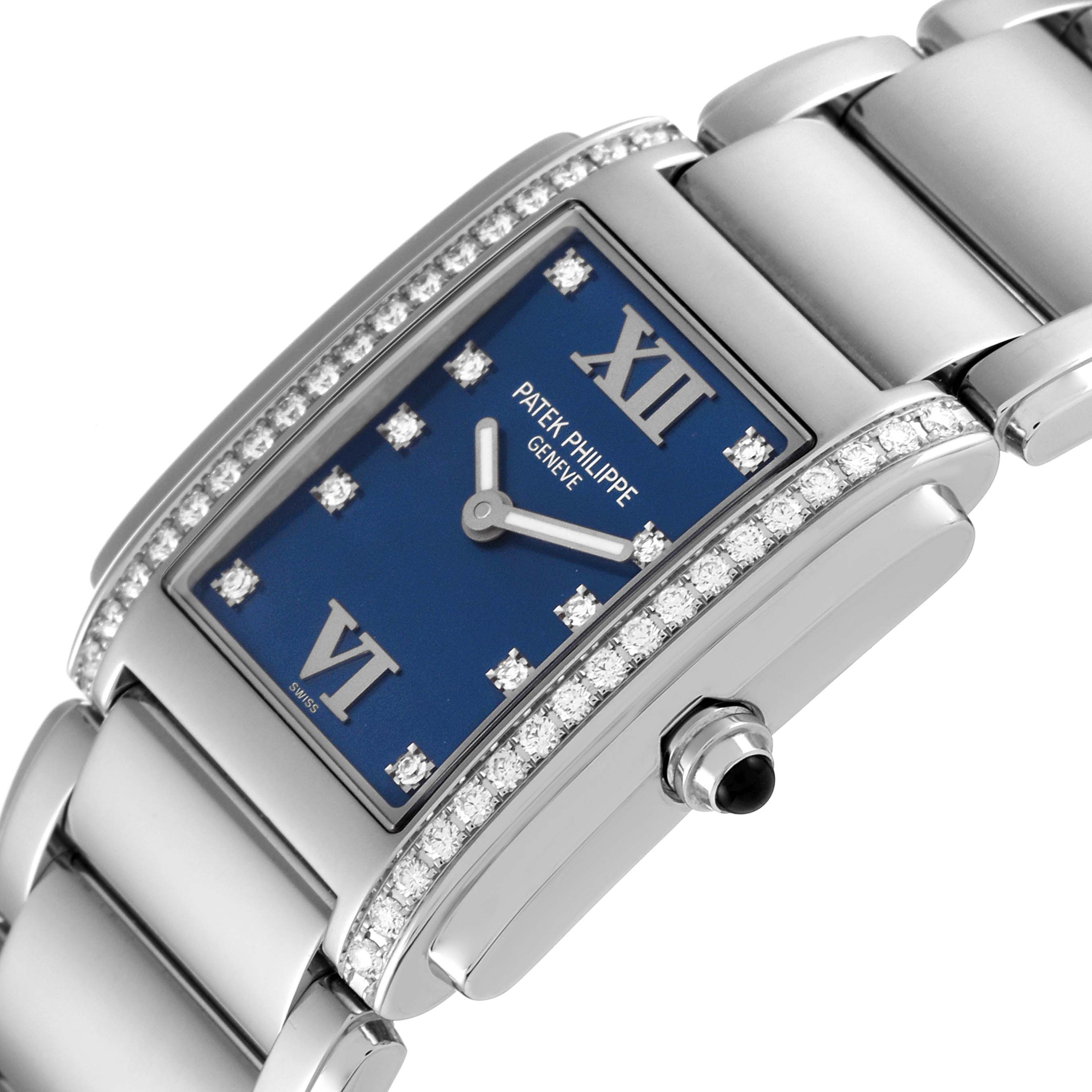 The image shows a close-up angle of the Patek Philippe Twenty-4 4910-10A-012 Women's Stainless Steel Blue Dial 4910-10A-012 Women's Stainless Steel Blue Dial watch highlighting its blue dial, diamond bezel, and bracelet.