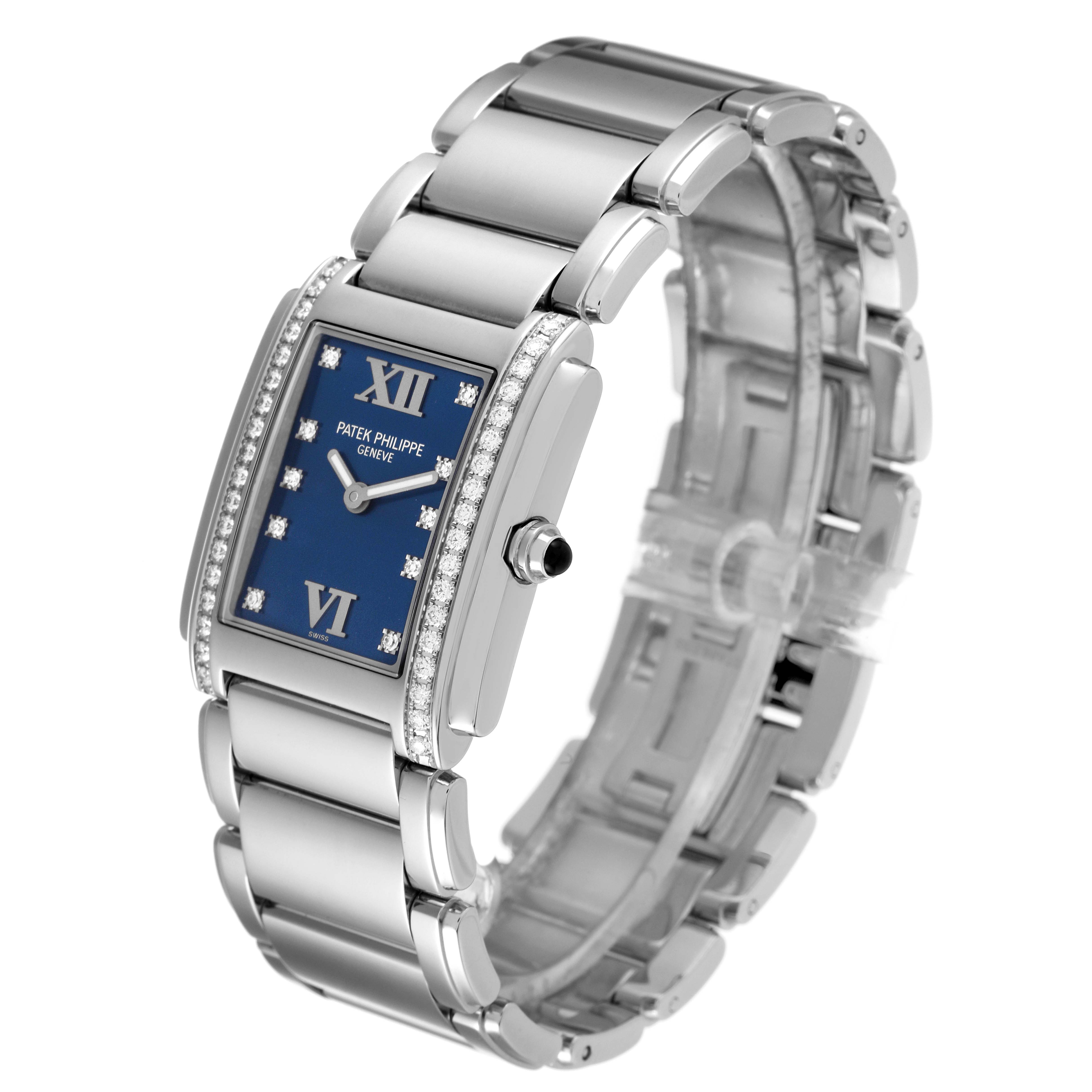 The image shows a Patek Philippe Twenty-4 4910-10A-012 Women's Stainless Steel Blue Dial 4910-10A-012 Women's Stainless Steel Blue Dial model watch angled to display the face, bracelet, and crown.