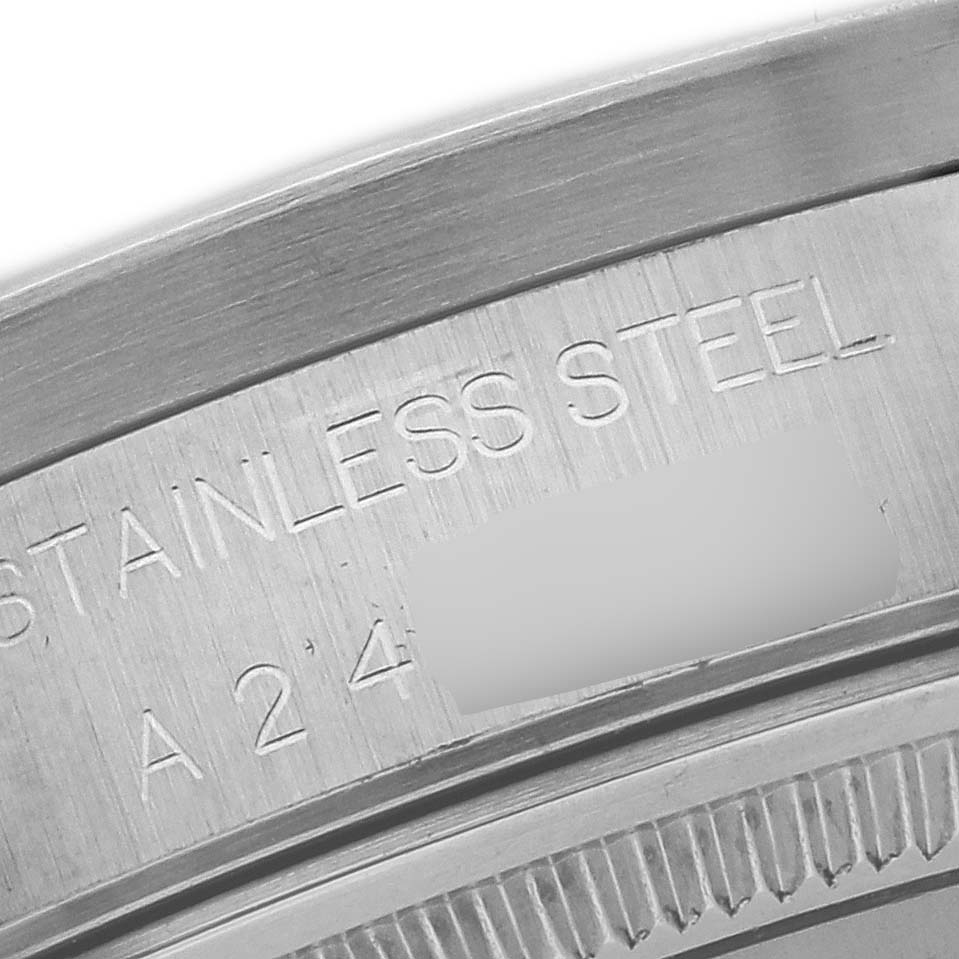 The image shows a close-up of the case back edge on a Rolex Air-King 14010 Men's Stainless Steel Black Dial 14010 Men's Stainless Steel Black Dial, highlighting the "Stainless Steel" engraving.