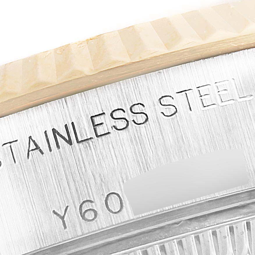 This close-up angle shows the side of the stainless steel case of a Rolex Datejust 79173 Women's Steel and Gold (two tone) White Dial 79173 Women's Steel and Gold (two tone) White Dial model watch.