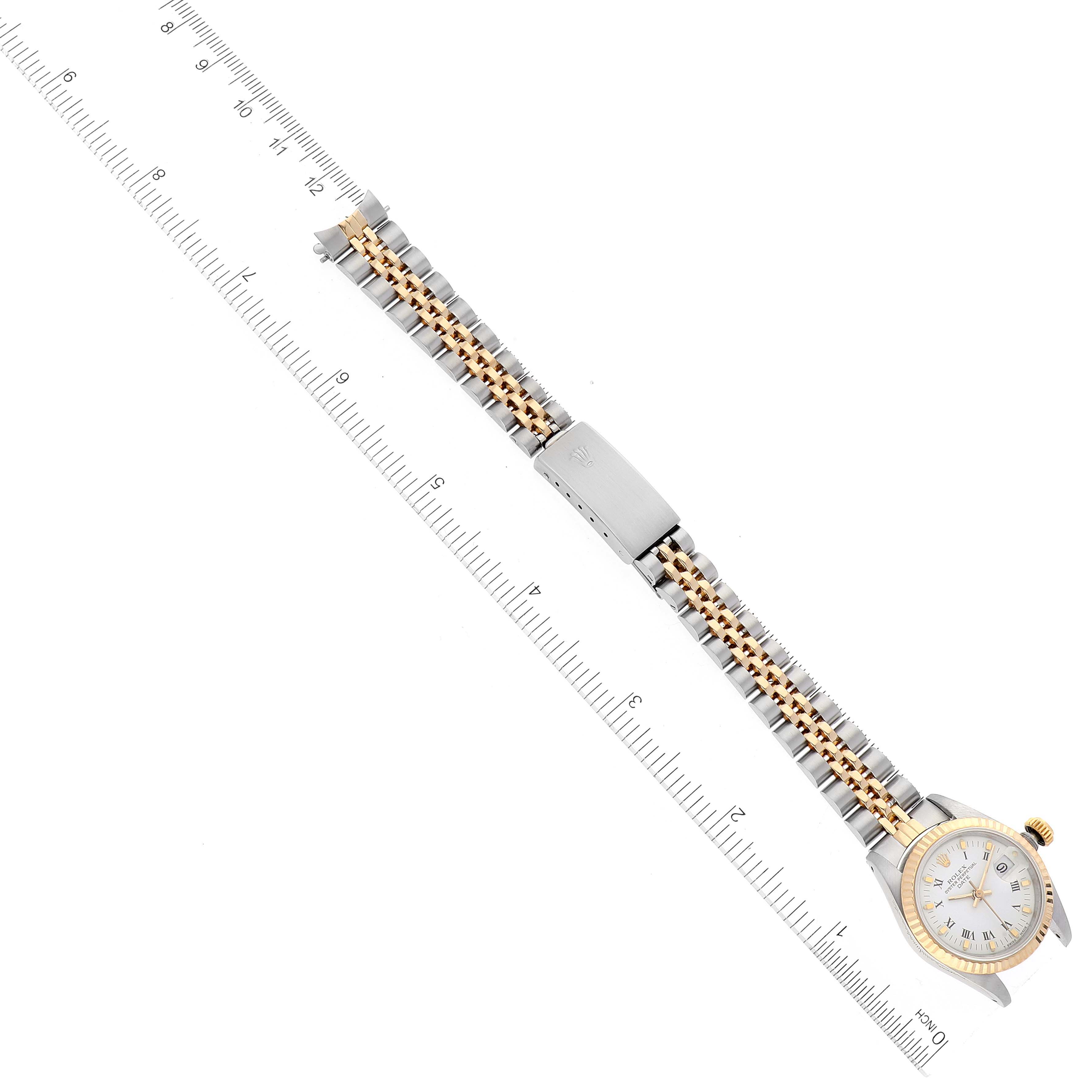 The image shows the Rolex Datejust 69173 Women's Steel and Gold (two tone) White Dial 69173 Women's Steel and Gold (two tone) White Dial watch laid flat with a ruler beside it for measurement, highlighting the strap and part of the dial.