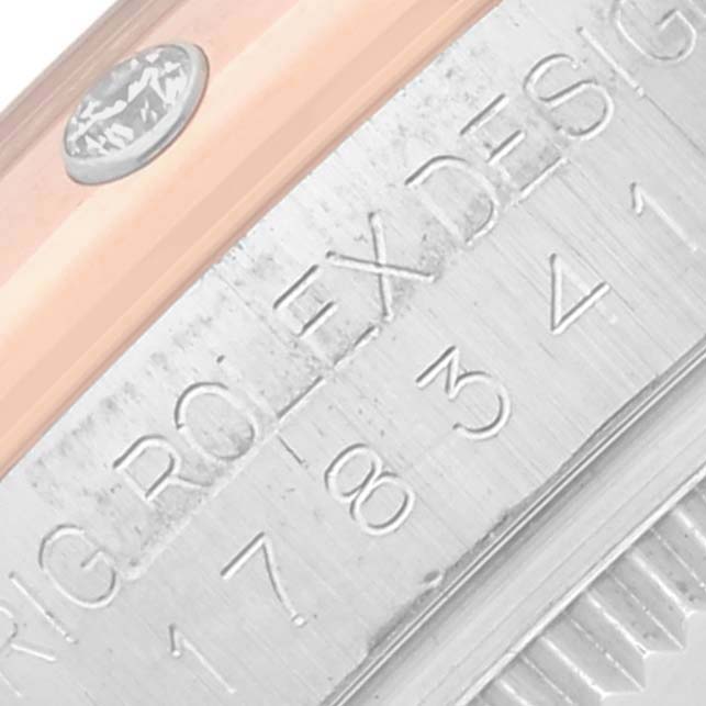 The image shows a close-up of the side engraving and edge of a Rolex Mid-Size 178341 Women's Steel and Gold (two tone) Mother of Pearl Dial 178341 Women's Steel and Gold (two tone) Mother of Pearl Dial watch.