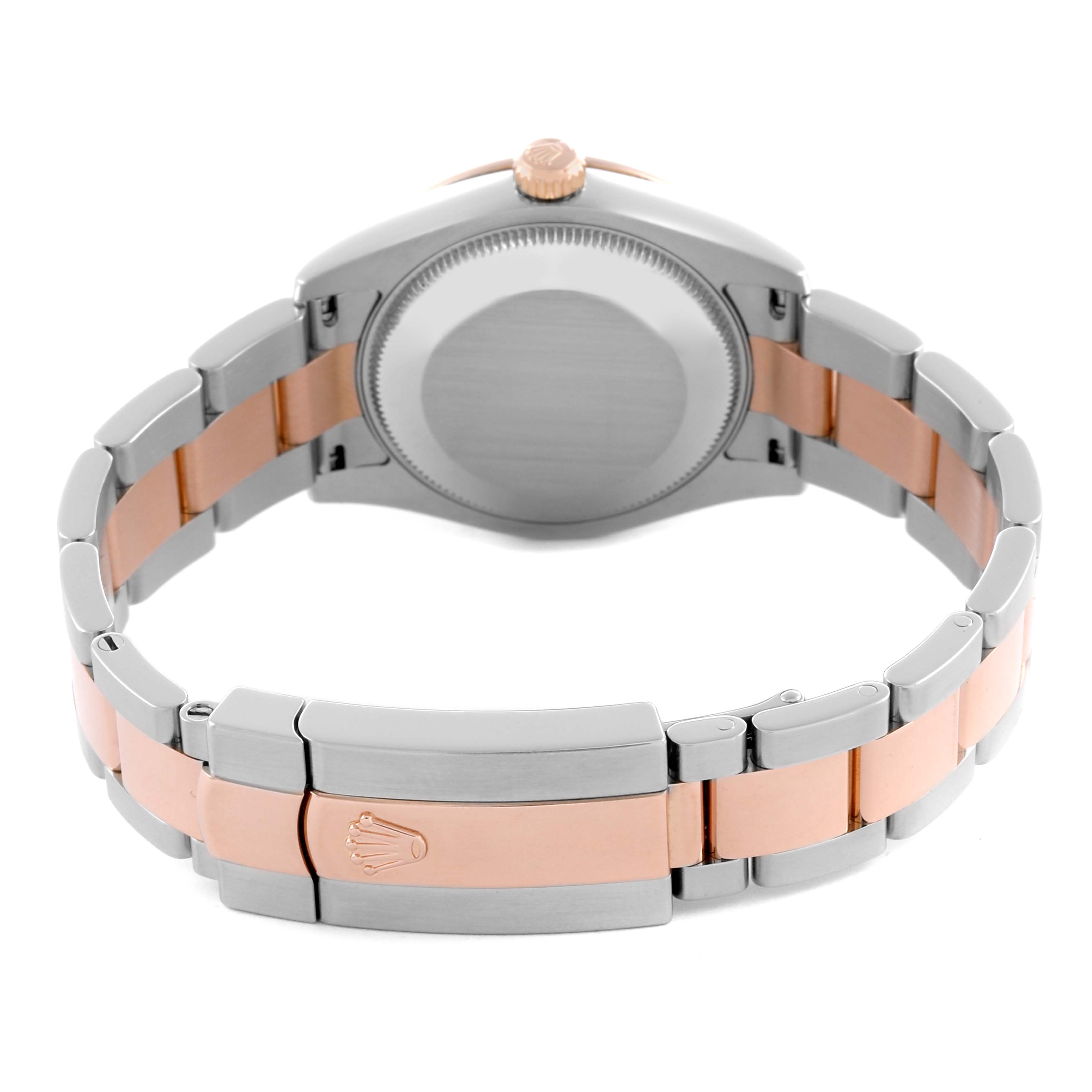 The Rolex Mid-Size 178341 Women's Steel and Gold (two tone) Mother of Pearl Dial 178341 Women's Steel and Gold (two tone) Mother of Pearl Dial watch is shown from the back, highlighting the case back, bracelet, and clasp.