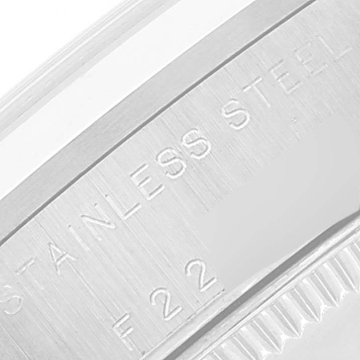 This close-up image shows the stainless steel back case of a Rolex Mid-Size 78240 Women
s Stainless Steel White Dial 78240 Women
s Stainless Steel White Dial watch.