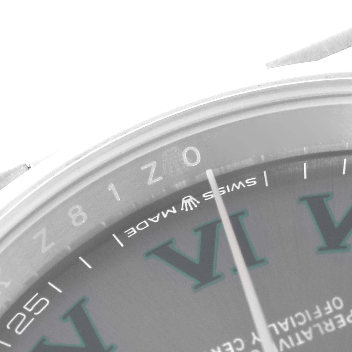 This close-up shot of a Rolex Datejust 126200 Men's Stainless Steel Grey Dial 126200 Men's Stainless Steel Grey Dial watch shows part of the dial, the "SWISS MADE" text, and large Roman numerals.