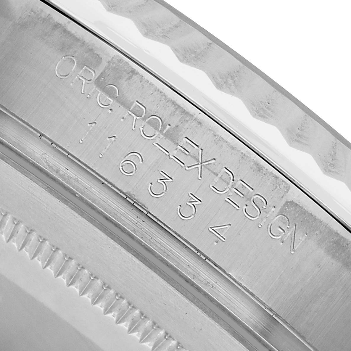 The image shows an angled view of the side engraving on a Rolex Datejust 41 116334 Men's Stainless Steel Silver Dial watch.