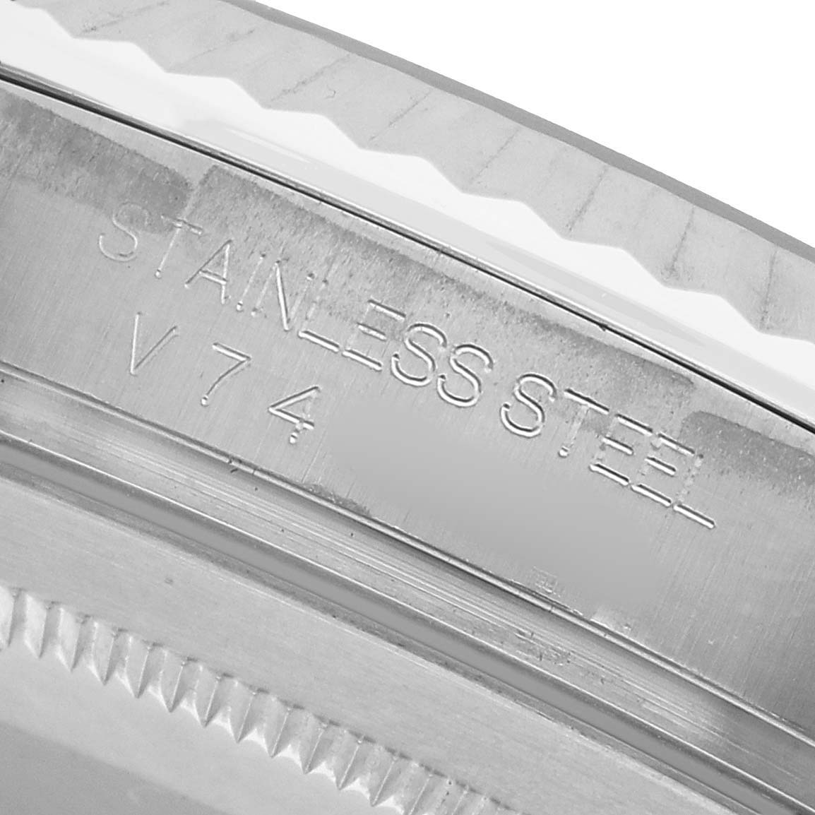 The image shows a close-up of the stainless steel bezel of a Rolex Datejust 41 116334 Men's Stainless Steel Silver Dial, highlighting the engraved text.