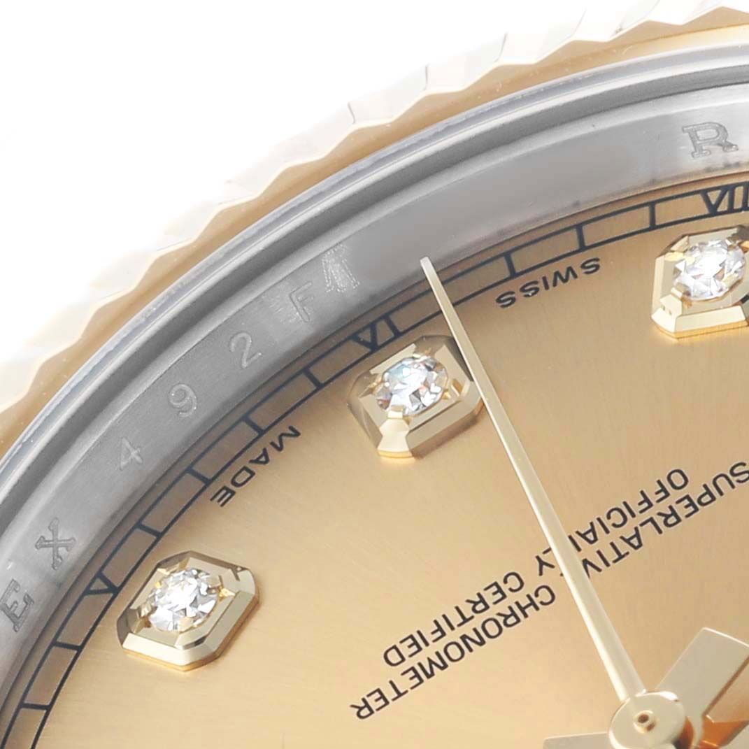 The image shows a close-up of the dial of a Rolex Datejust 41 116333 Men's Steel and Gold (two tone) Champagne Dial, highlighting the diamond markers and part of the bezel.