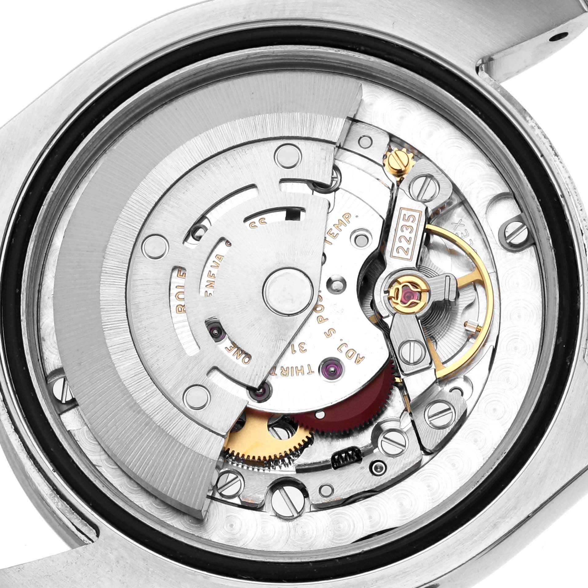 The image shows the movement of a Rolex Mid-Size 178240 Women's Stainless Steel Pink Dial watch from an overhead angle, revealing the rotor, gears, and other internal components.