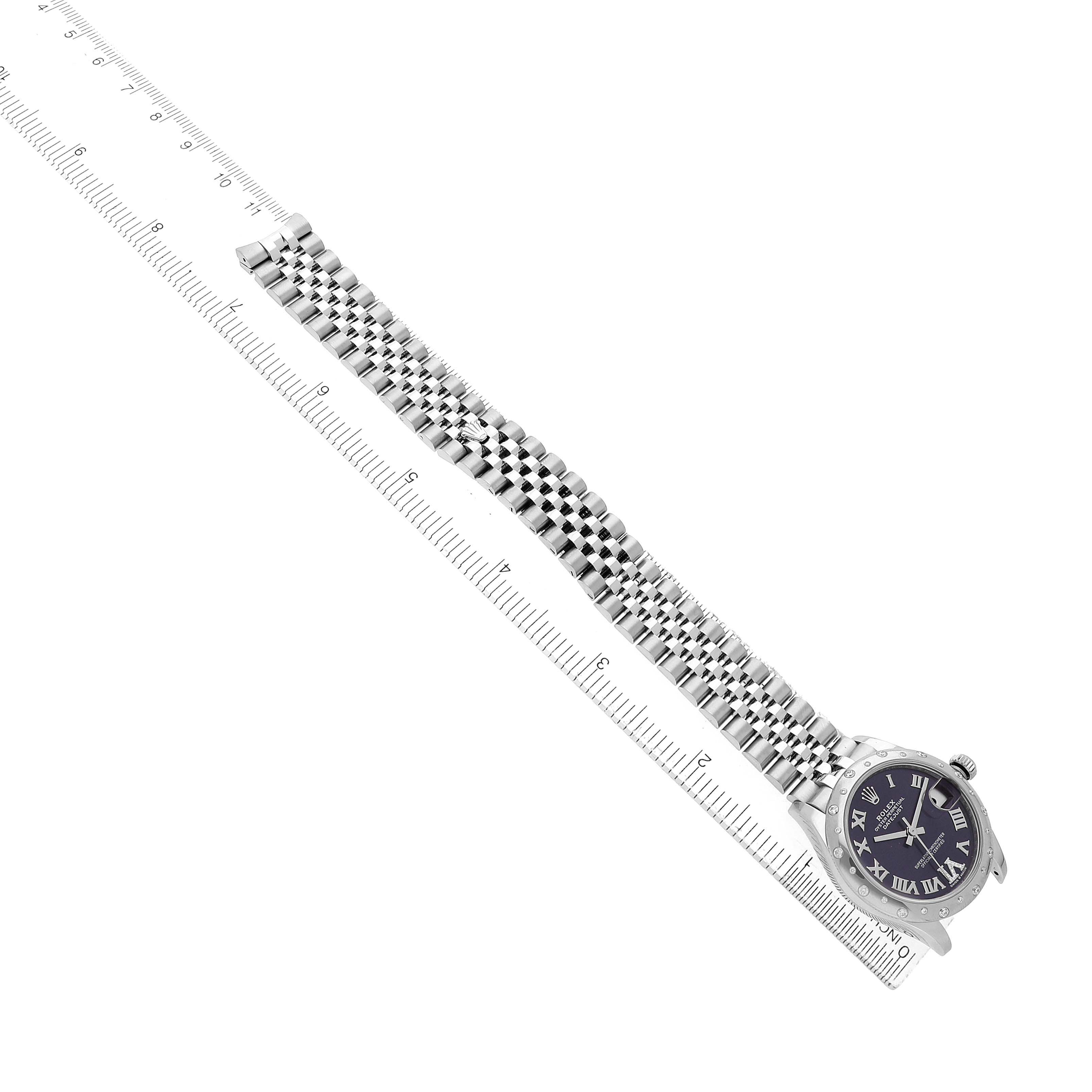 The Rolex Mid-Size 278344 Women's Stainless Steel Purple Dial watch is shown from an angled top view, highlighting the face and band alongside a measuring rule.