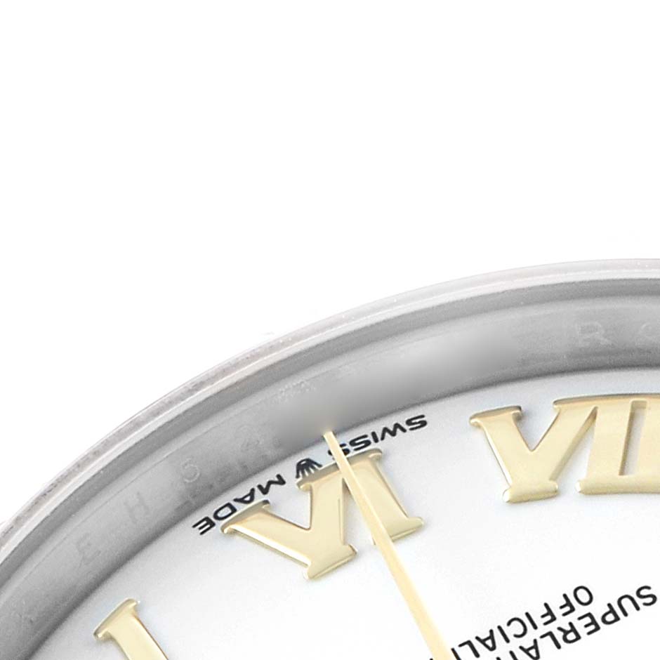 The image shows a close-up angle of the Rolex Mid-Size 278273 Women's Steel and Gold (two tone) White Dial watch's dial, featuring Roman numerals and "Swiss Made" text.
