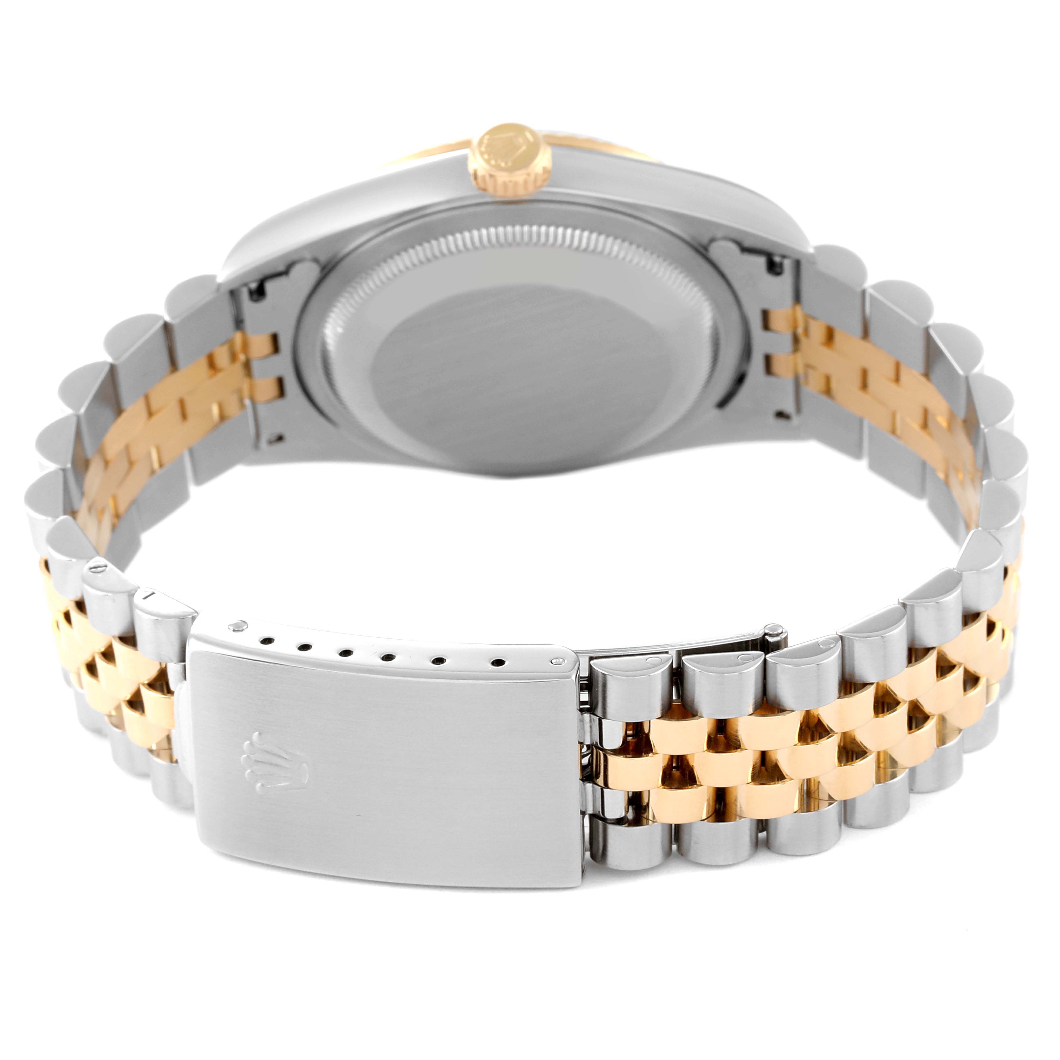 The image shows the back and bracelet of a Rolex Datejust 16233 Men's Steel and Gold (two tone) Black Dial 16233 Men's Steel and Gold (two tone) Black Dial watch, highlighting its two-tone metal finish and clasp.