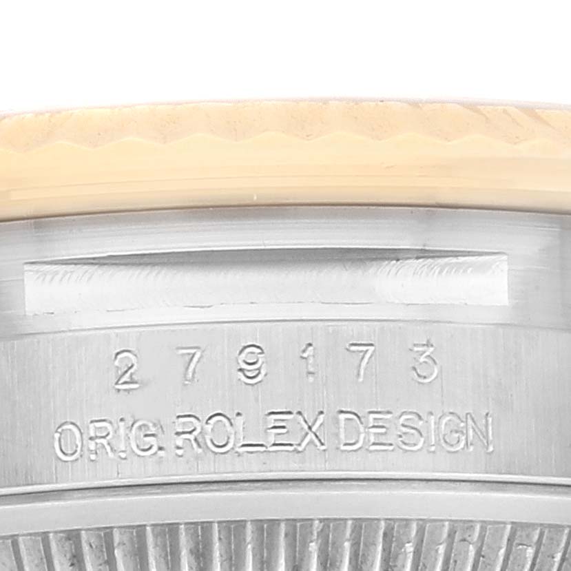 The image shows a close-up of the serial number and engraving on the side of a Rolex Datejust 279173 Women's Steel and Gold (two tone) Champagne Dial 279173 Women's Steel and Gold (two tone) Champagne Dial watch.