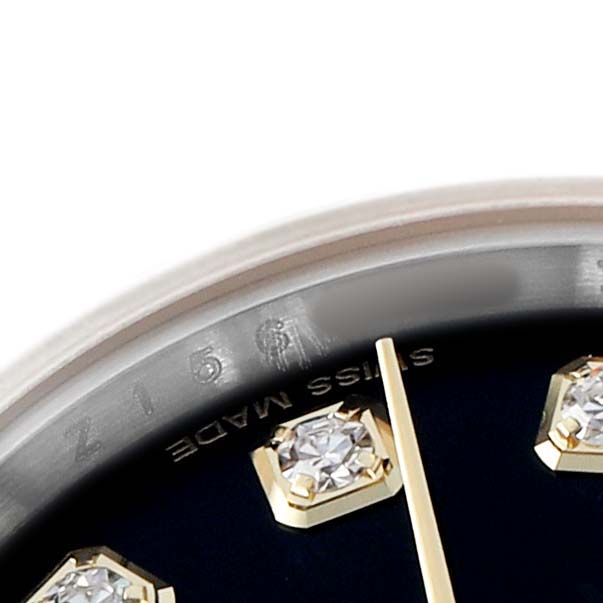 The image shows a close-up of the Rolex Datejust 179173 Women's Steel and Gold (two tone) Black Dial watch's dial, focusing on diamond hour markers and the edge of the bezel.