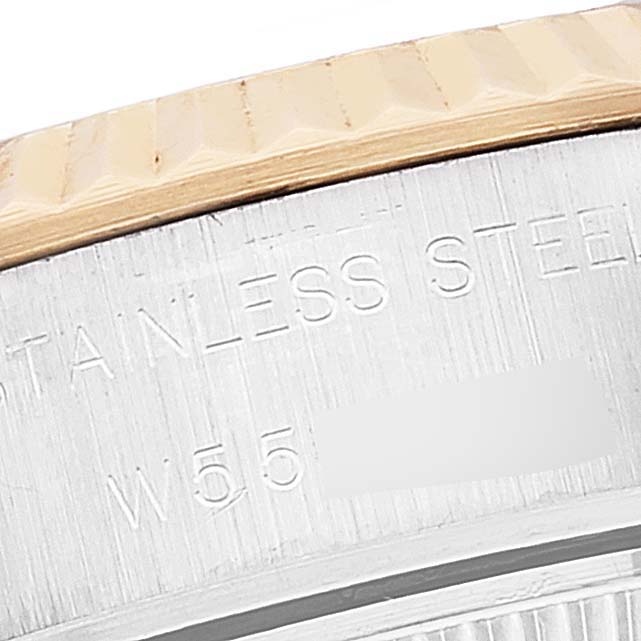 This close-up image shows the bezel and case of a Rolex Datejust 69173 Women's Steel and Gold (two tone) Champagne Dial 69173 Women's Steel and Gold (two tone) Champagne Dial watch, highlighting the etched "STAINLESS STEEL" text.