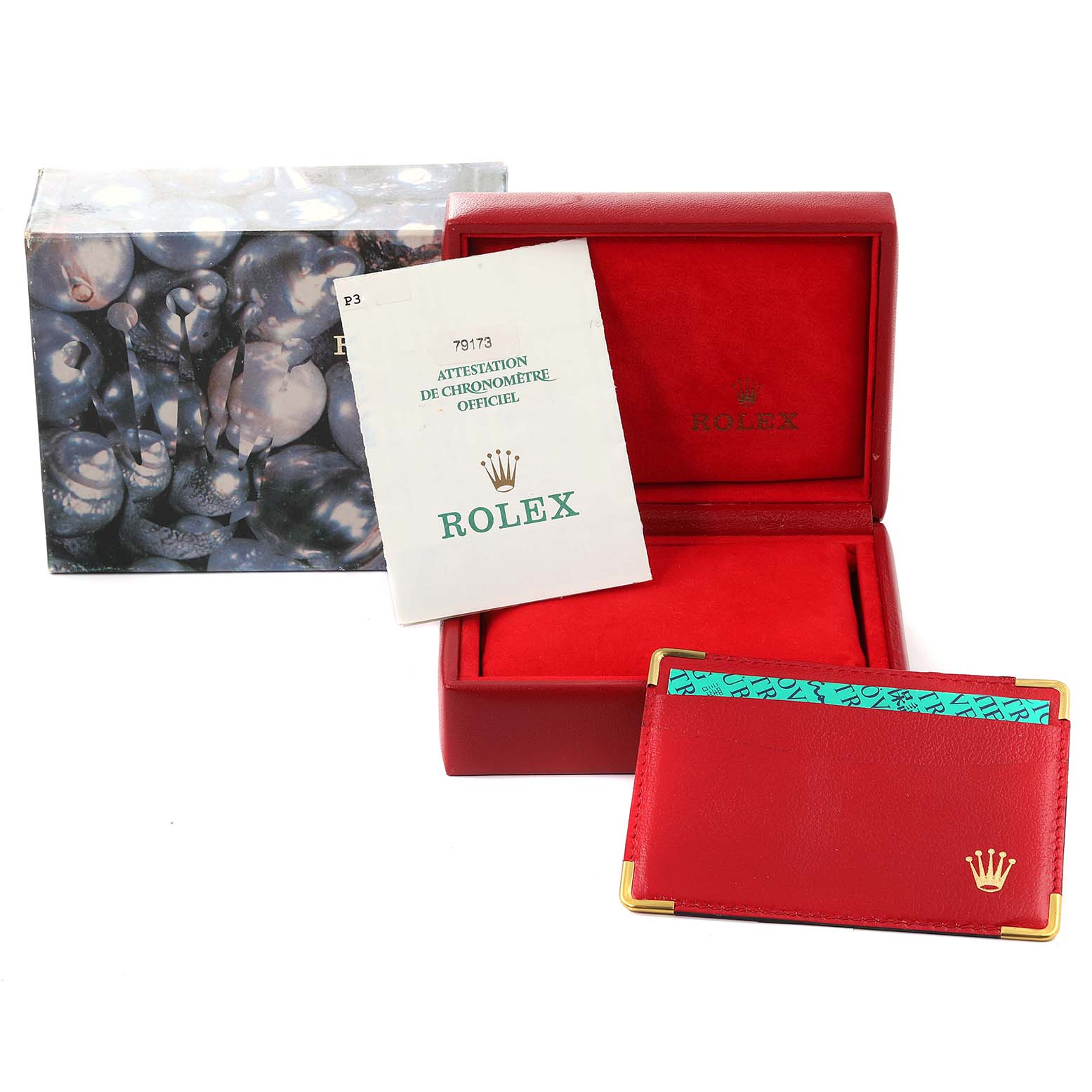 The image shows a Rolex Datejust 79173 Women's Steel and Gold (two tone) Champagne Dial 79173 Women's Steel and Gold (two tone) Champagne Dial watch box, warranty booklet, and red card holder from a slightly angled top view.