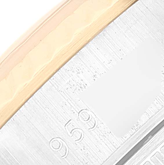 The image shows a close-up of the edge and part of the bezel of a Rolex Datejust 69173 Women's Steel and Gold (two tone) Champagne Dial 69173 Women's Steel and Gold (two tone) Champagne Dial watch.