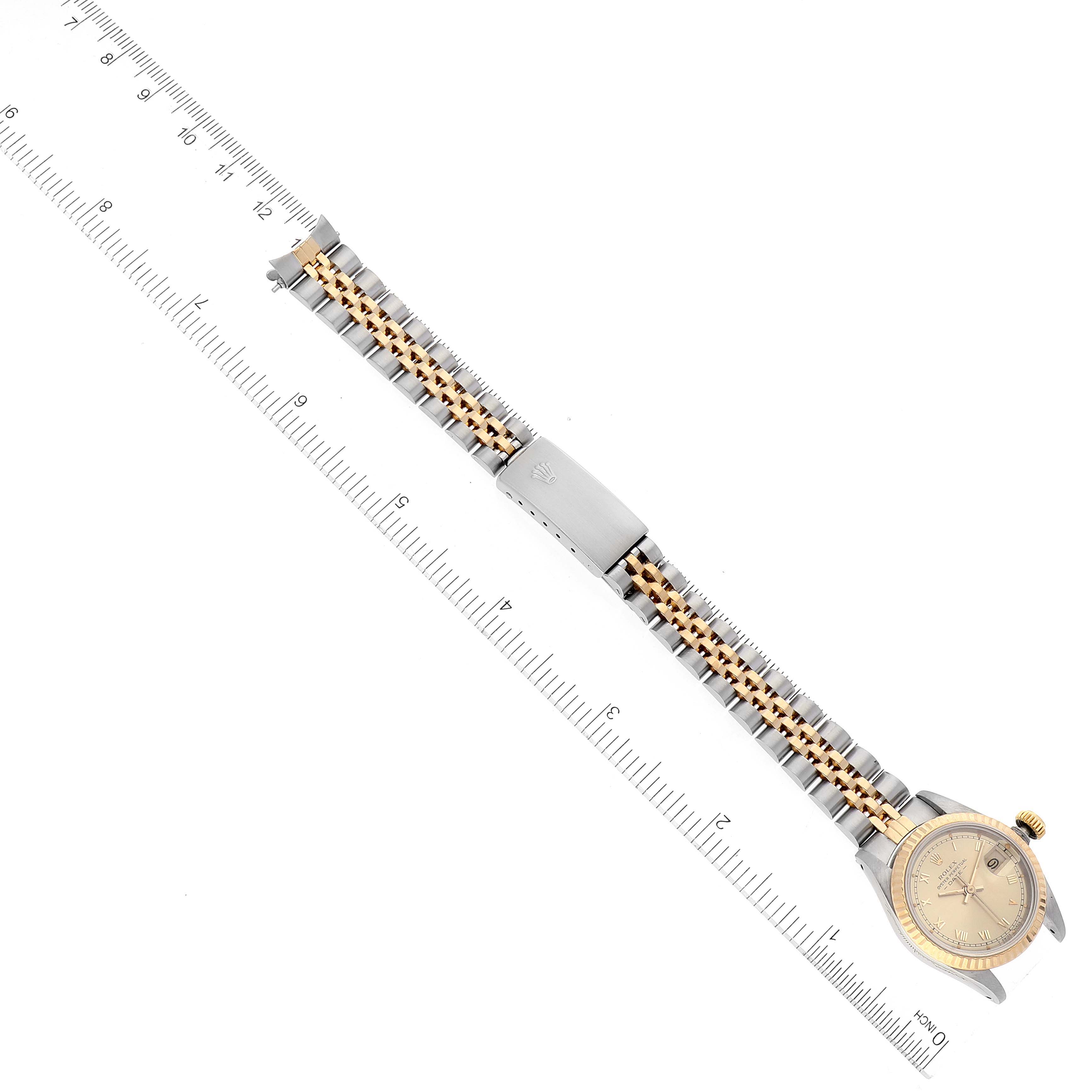 This image shows a Rolex Datejust 69173 Women's Steel and Gold (two tone) Champagne Dial 69173 Women's Steel and Gold (two tone) Champagne Dial watch from an overhead angle, highlighting the band, clasp, and face.