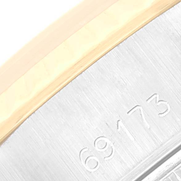 The image shows a close-up of the serial number engraving on the Rolex Datejust 69173 Women's Steel and Gold (two tone) Champagne Dial 69173 Women's Steel and Gold (two tone) Champagne Dial watch case.