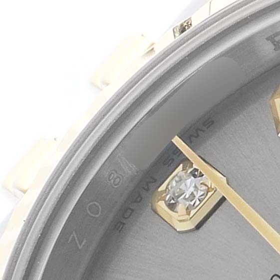 The image shows a close-up of a Rolex Datejust 179173 Women's Steel and Gold (two tone) Grey Dial watch, focusing on the dial edge, hour marker, and partial bezel.