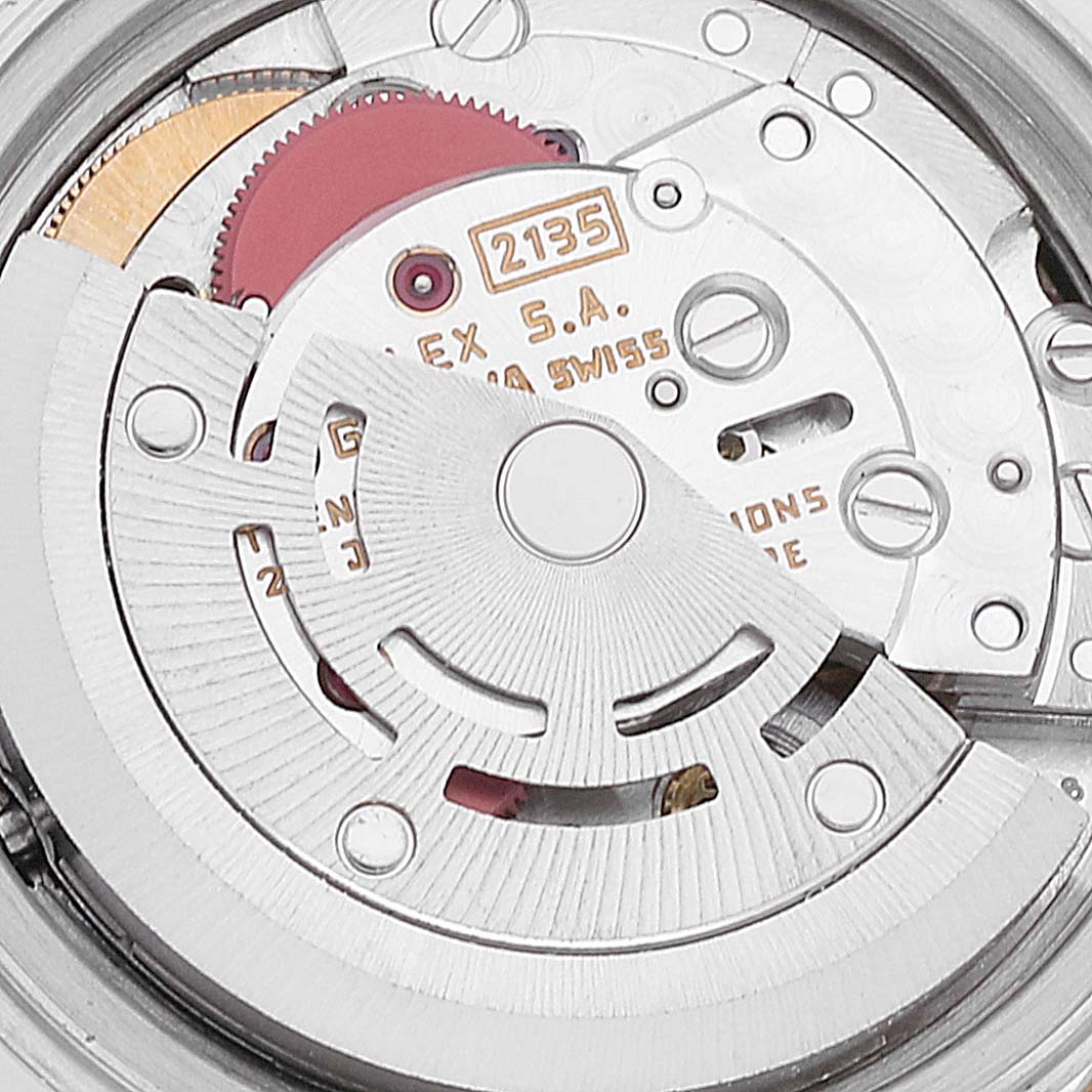 This is a close-up image of the internal movement parts of a Rolex Datejust 69173 Women's Steel and Gold (two tone) Champagne Dial 69173 Women's Steel and Gold (two tone) Champagne Dial watch, highlighting components like gears and the rotor.