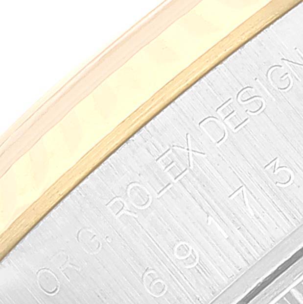This image shows a close-up angle of the engraved side edge of the Rolex Datejust 69173 Women's Steel and Gold (two tone) White Dial 69173 Women's Steel and Gold (two tone) White Dial watch, highlighting the text and metal details.