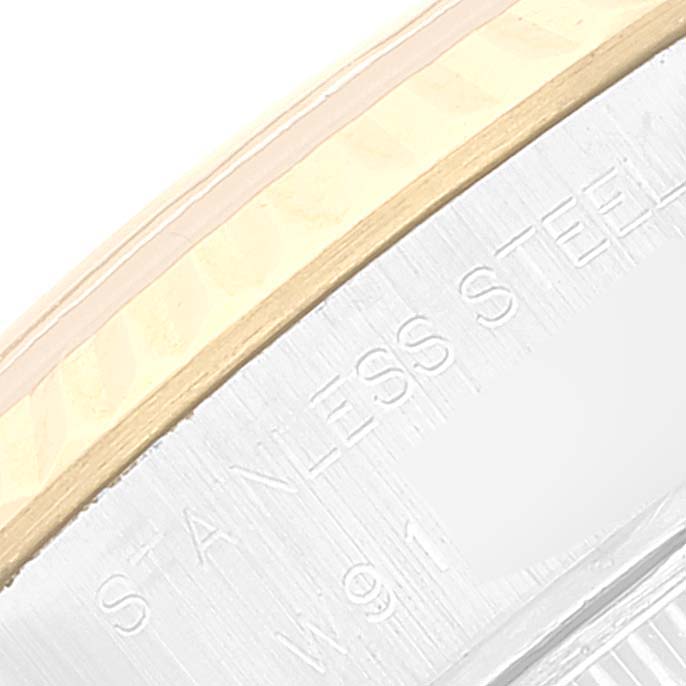A close-up of the Rolex Datejust 69173 Women's Steel and Gold (two tone) White Dial 69173 Women's Steel and Gold (two tone) White Dial watch case, showing the stainless steel and gold components with etched text.