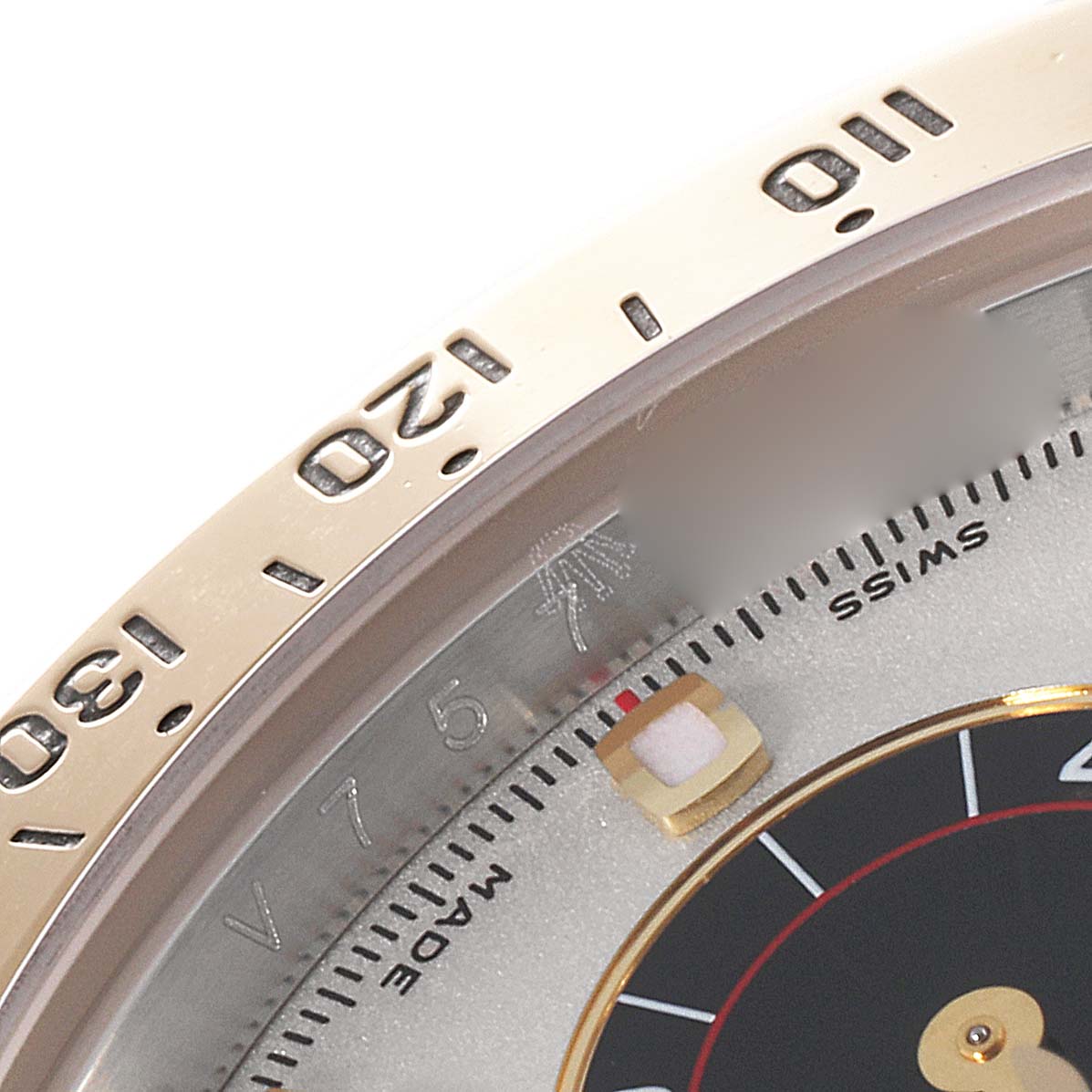 The image shows a close-up of the bezel, part of the dial, and inner markings of a Rolex Daytona 116523 Men's Steel and Gold (two tone) Silver Dial 116523 Men's Steel and Gold (two tone) Silver Dial watch.