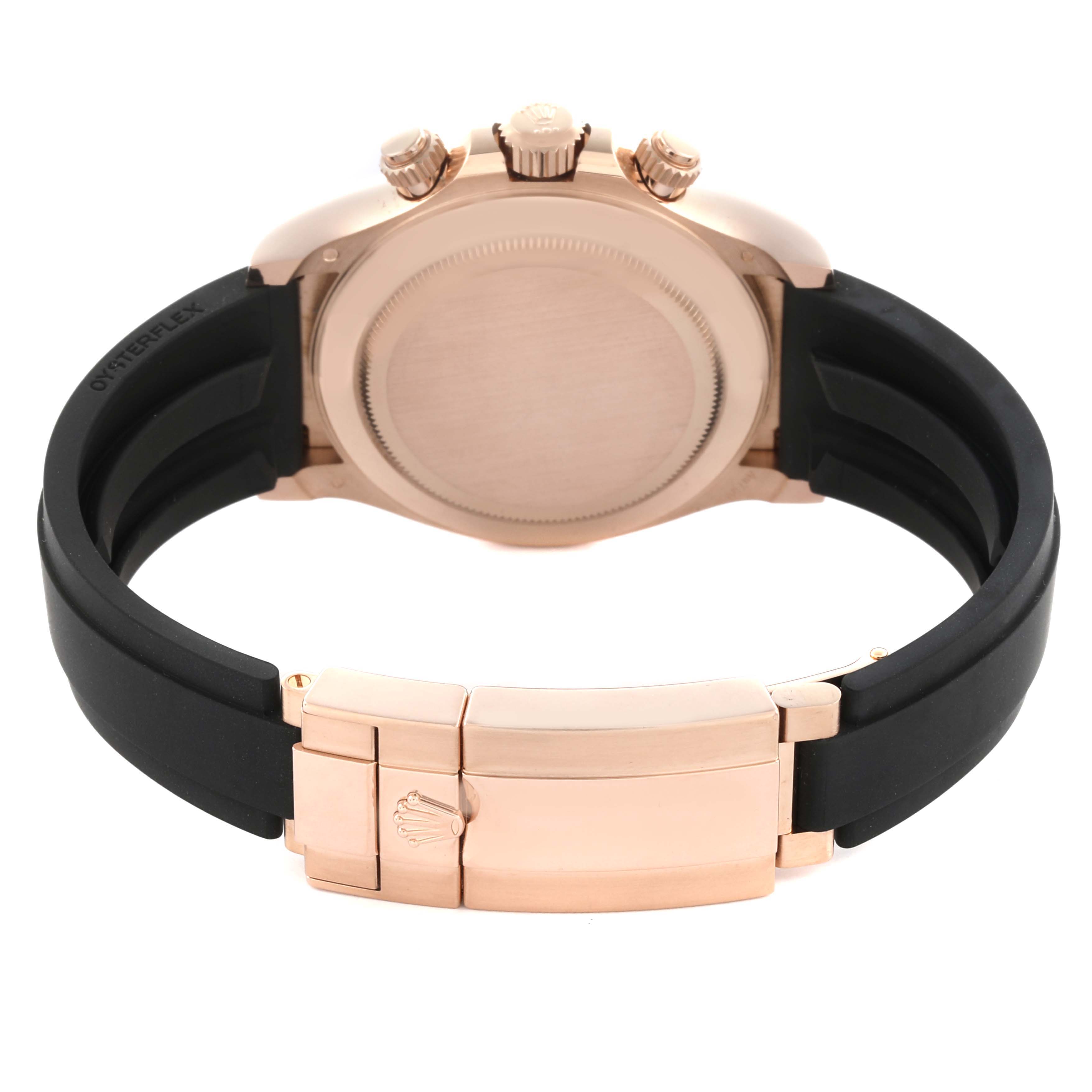 The image shows the back view of a Rolex Daytona 116515LN Men's Rose Gold Black Dial 116515LN Men's Rose Gold Black Dial watch, highlighting the case, crown, and clasp on the strap.