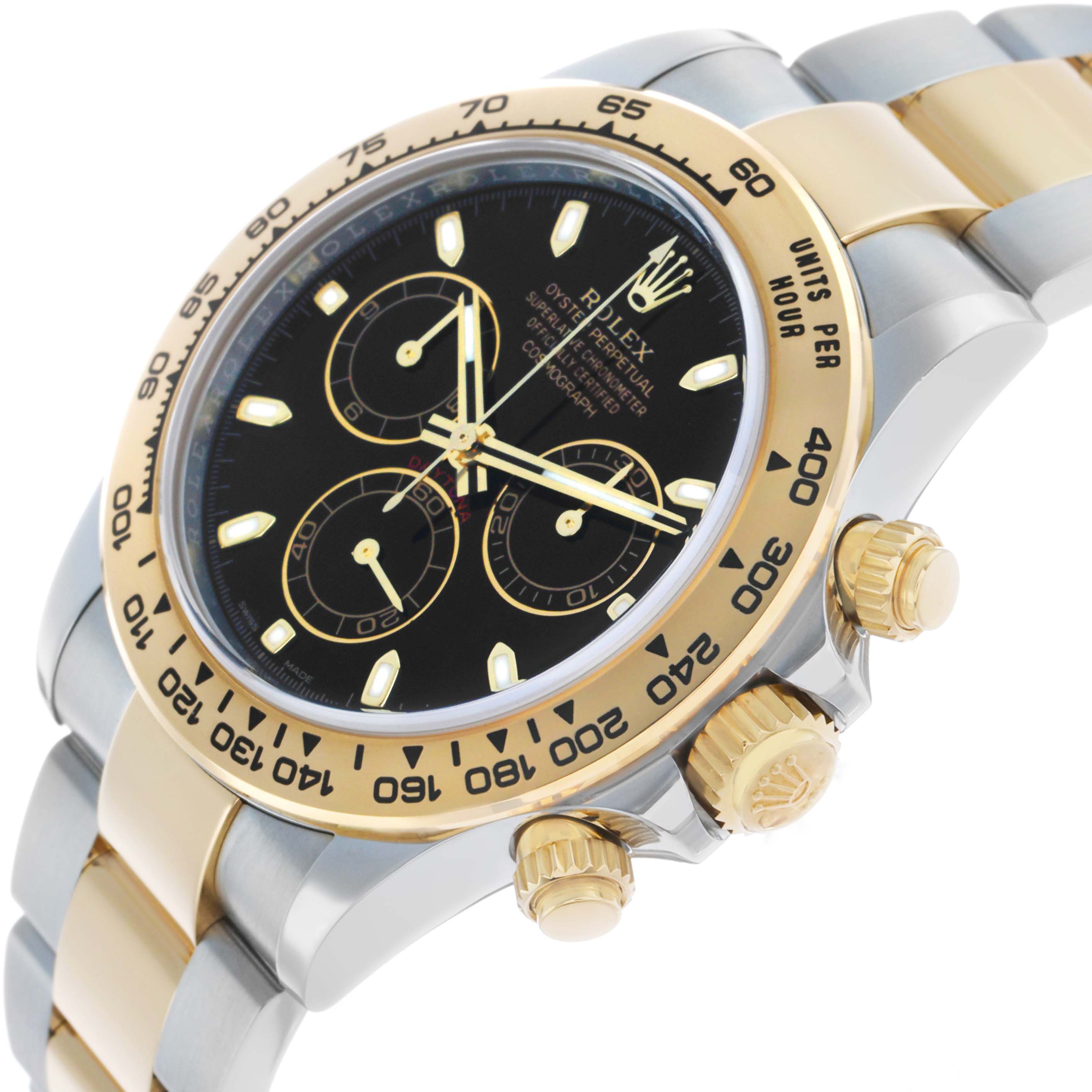 The image shows a Rolex Daytona 116503 Men's Steel and Gold (two tone) Black Dial watch at an angle, highlighting its bezel, dial, pushers, and bracelet links.