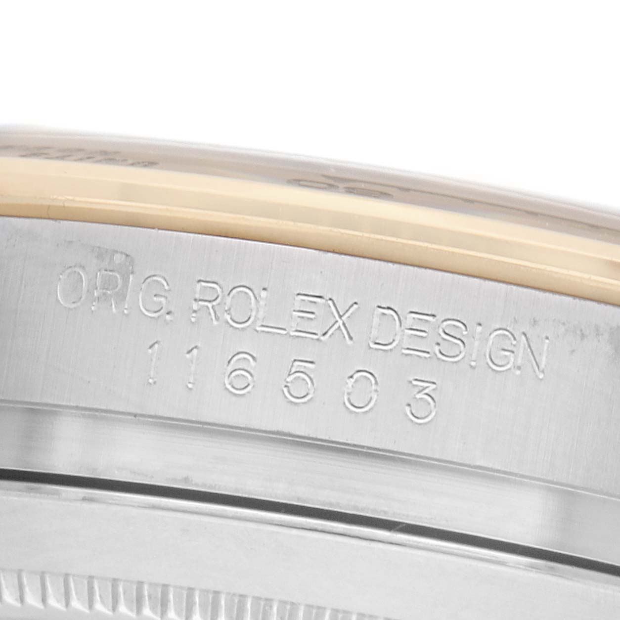 The image shows a close-up of the side engraving on a Rolex Daytona 116503 Men's Steel and Gold (two tone) Black Dial model, highlighting the serial and design numbers.