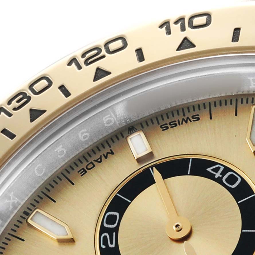 The image shows a close-up of the bezel and partial dial of a Rolex Daytona 126503 Men's Steel and Gold (two tone) Champagne Dial watch, highlighting the tachymetric scale and hour markers.