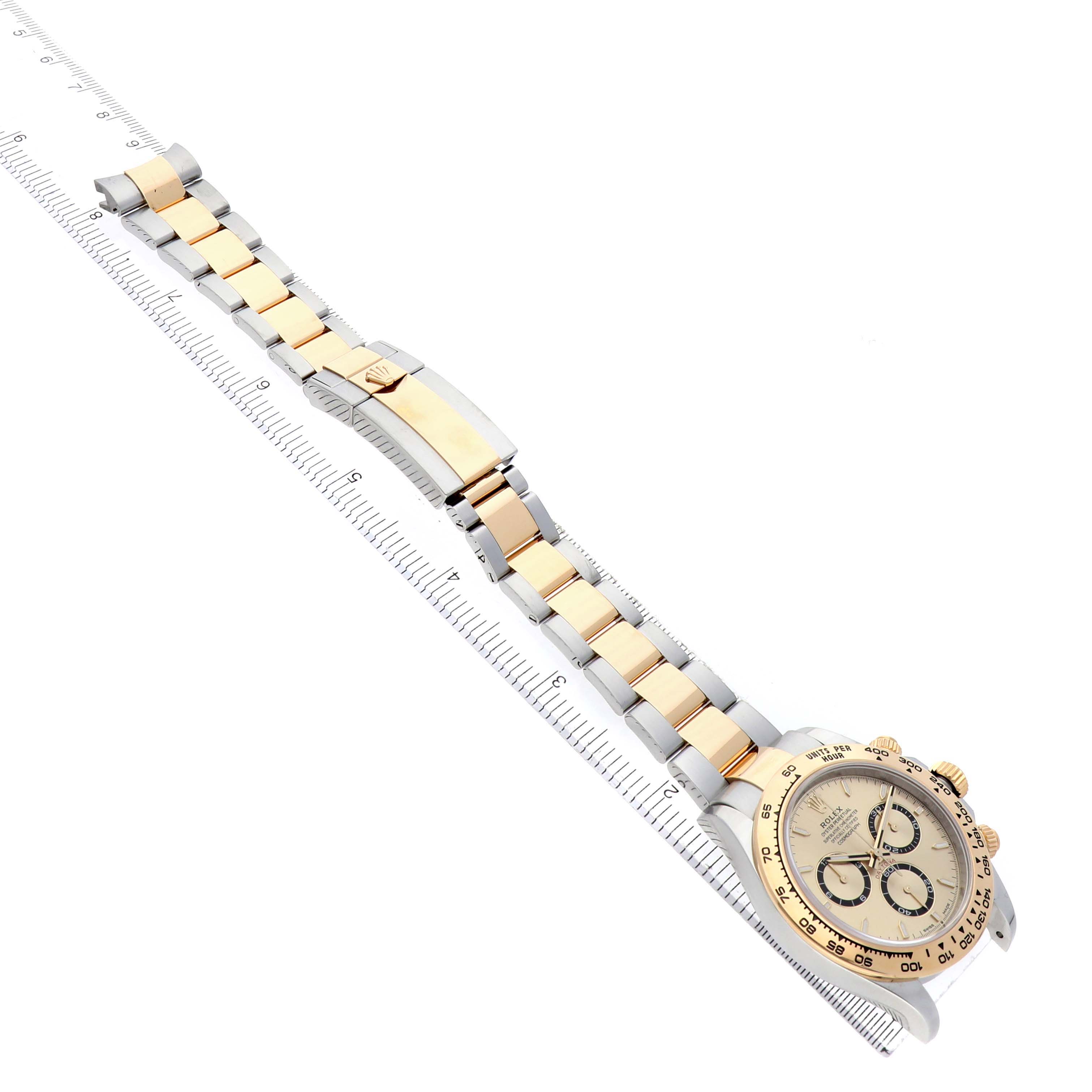 The Rolex Daytona 126503 Men's Steel and Gold (two tone) Champagne Dial watch is shown at an angle displaying the full bracelet, clasp, and partial view of the dial.
