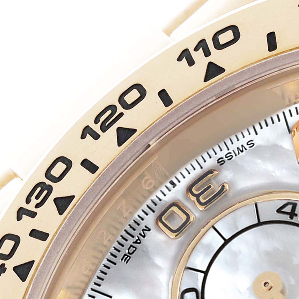 The image shows a close-up of the bezel and part of the dial of a Rolex Daytona 116508 Men's Yellow Gold Mother of Pearl Dial 116508 Men's Yellow Gold Mother of Pearl Dial watch.