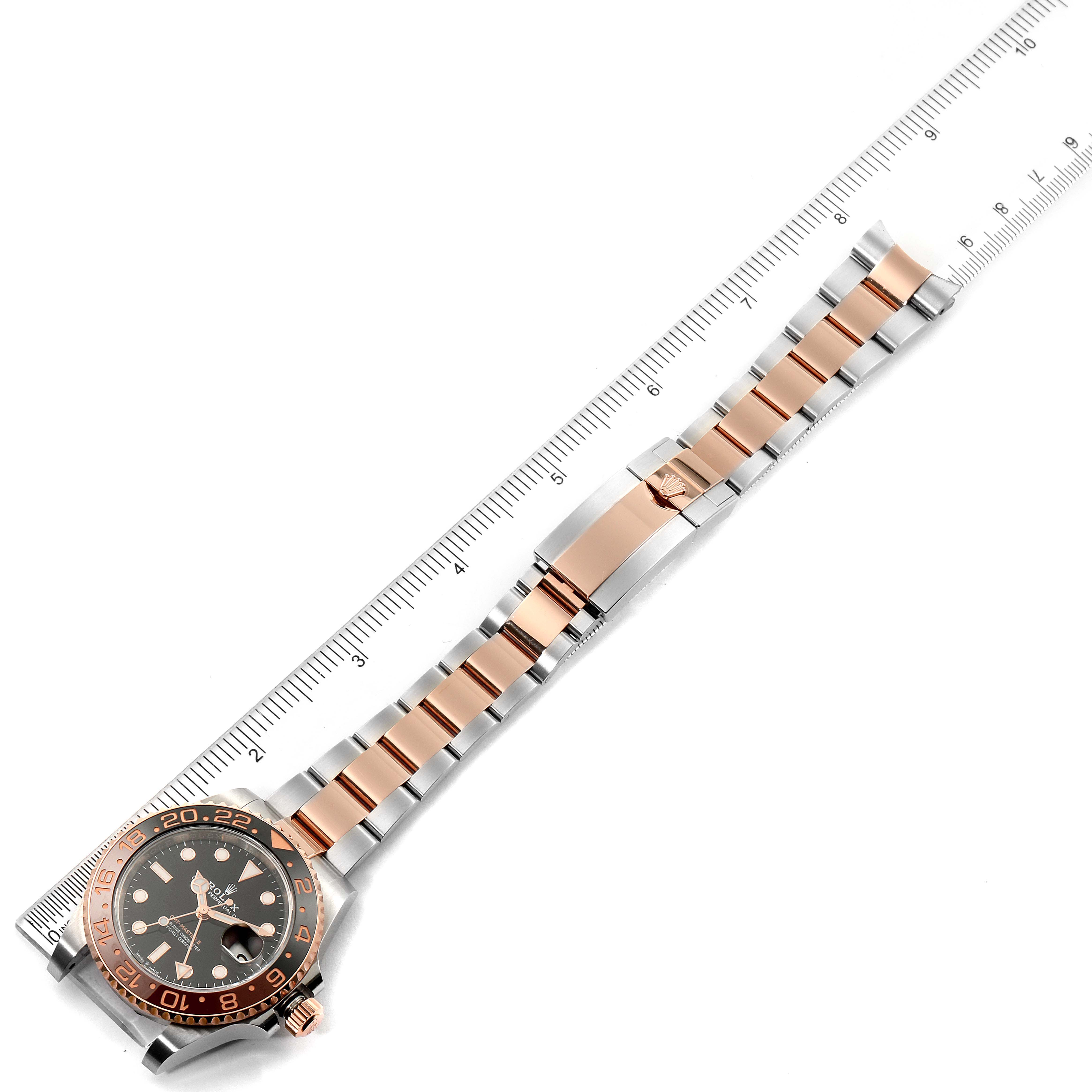 The image shows a Rolex GMT-Master 126711 Men's Stainless Steel Black Dial 126711 Men's Stainless Steel Black Dial watch with its bracelet laid flat beside a ruler for measurement.