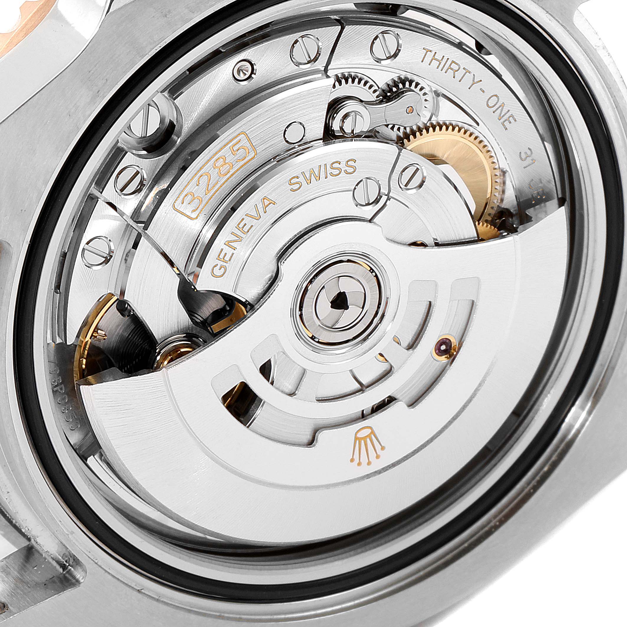 The image shows a close-up view of the Rolex GMT-Master 126711 Men's Stainless Steel Black Dial 126711 Men's Stainless Steel Black Dial 3285 movement, highlighting its intricate mechanisms and detailing.